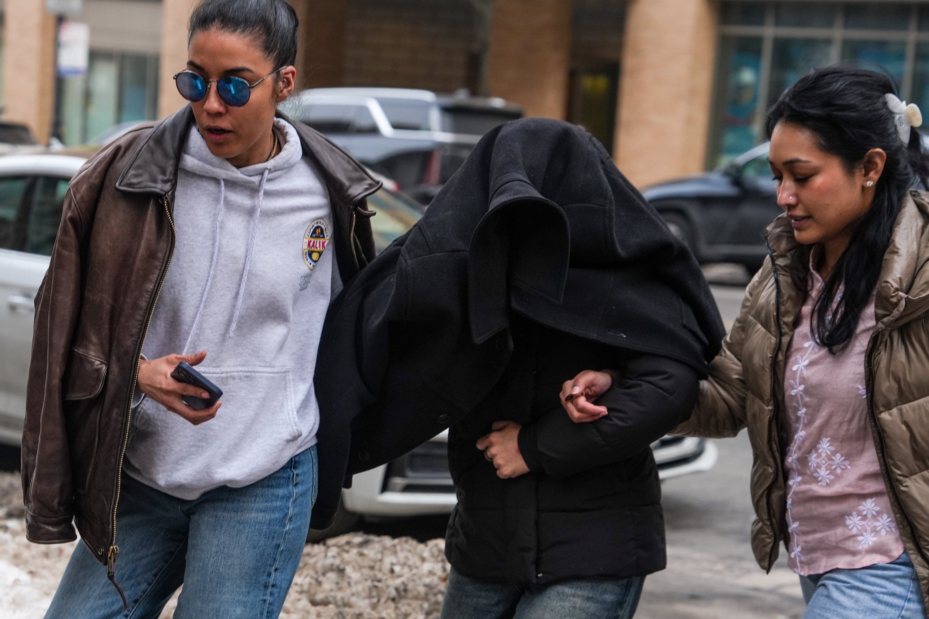 Aghayeva was escorted to her apartment with her face covered after her release (Getty Images)