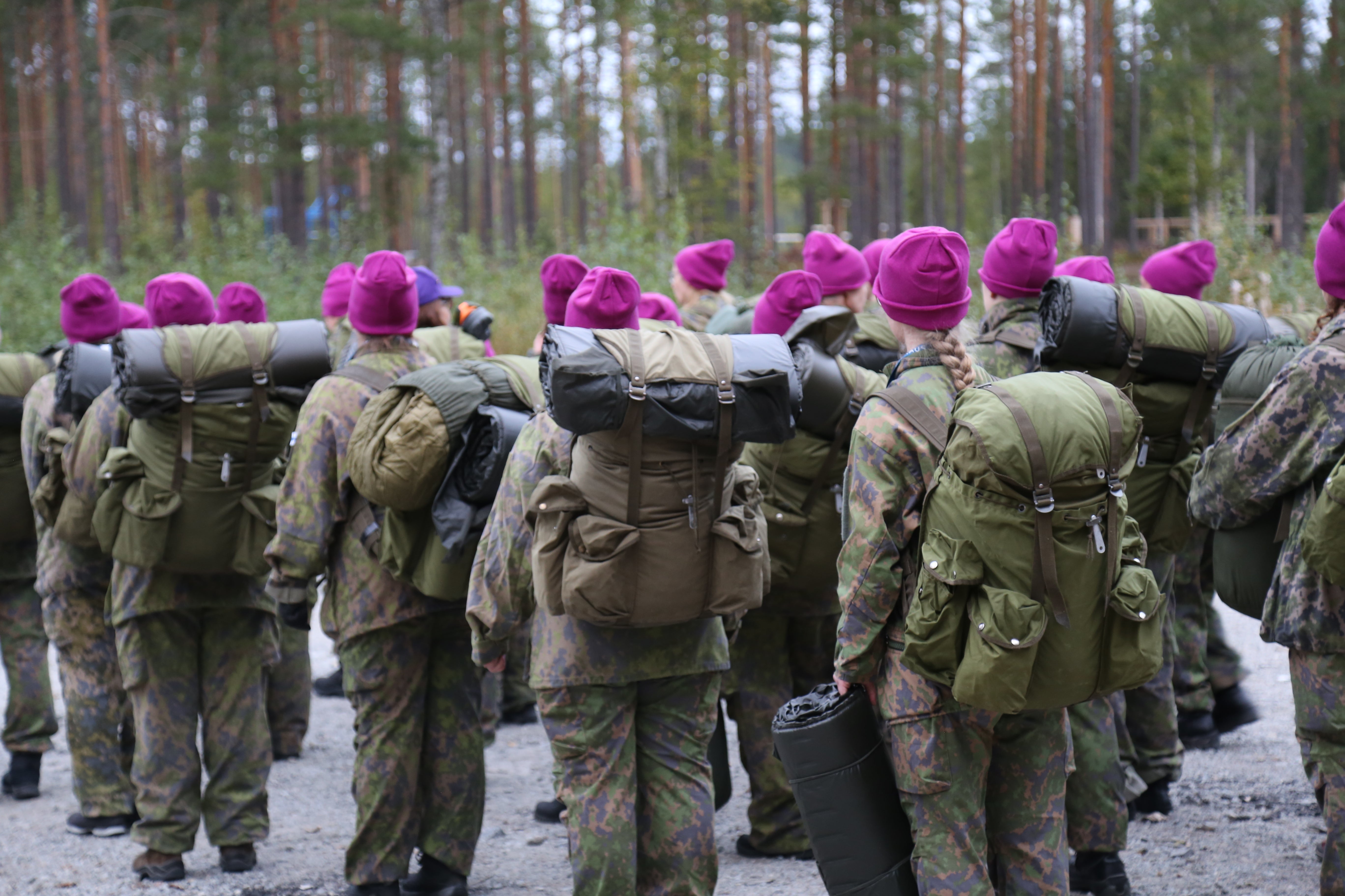 At Naisten Valmiusliitto training courses, women wear distinctive purple beanies along with their camo