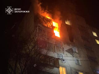 A residential building seen on fire following a Russian drone attack in Zaporizhzhia