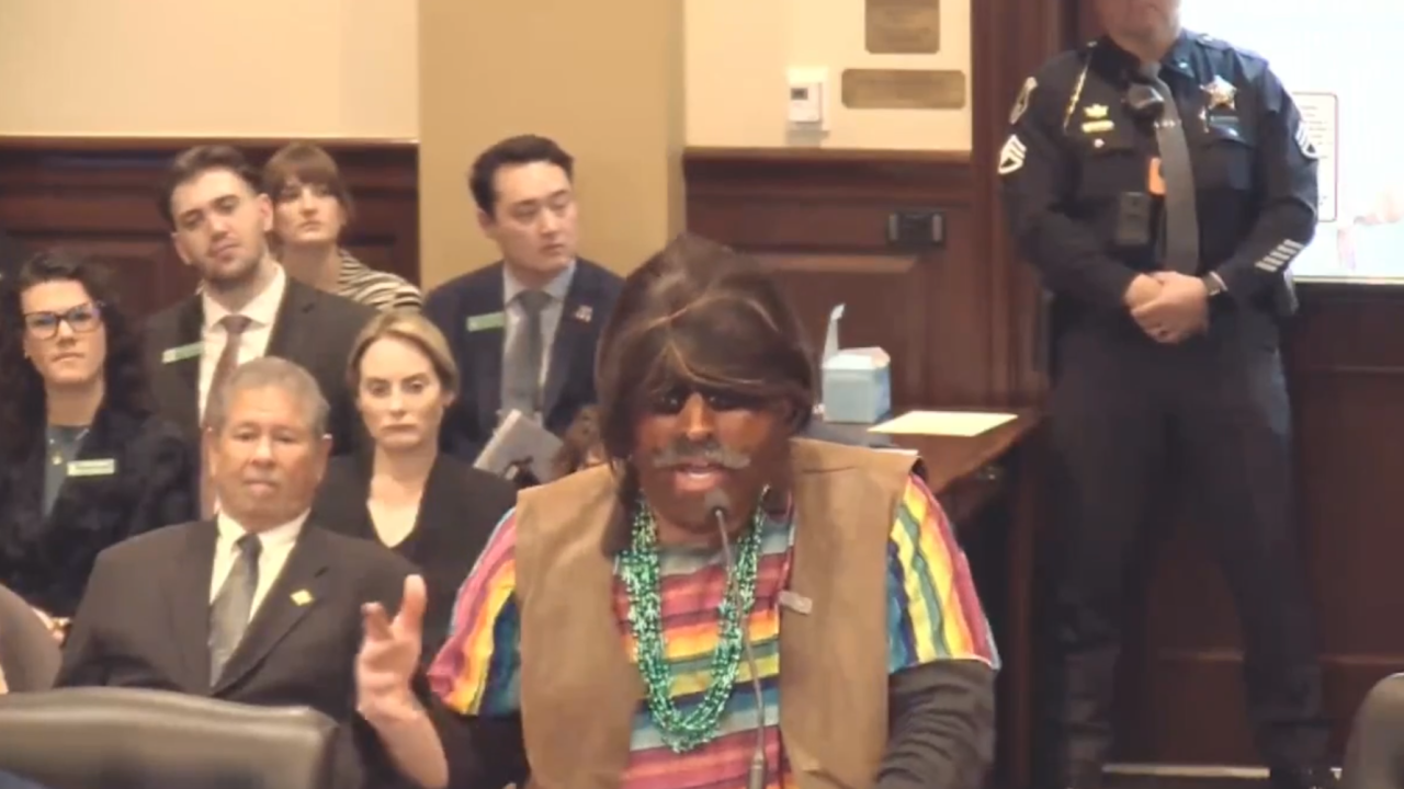Far-right agitator sparks outrage after showing up to testify in brownface
