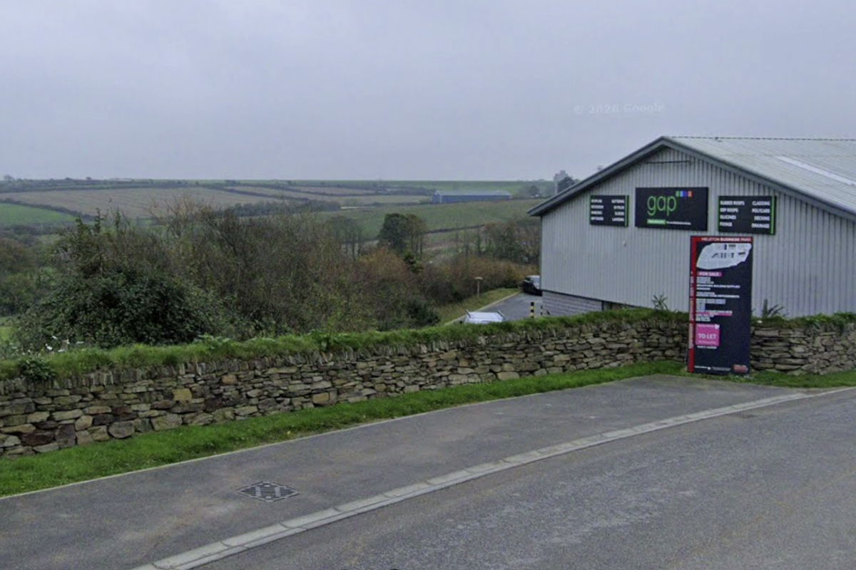 Women charged after man found dead inside car on industrial estate