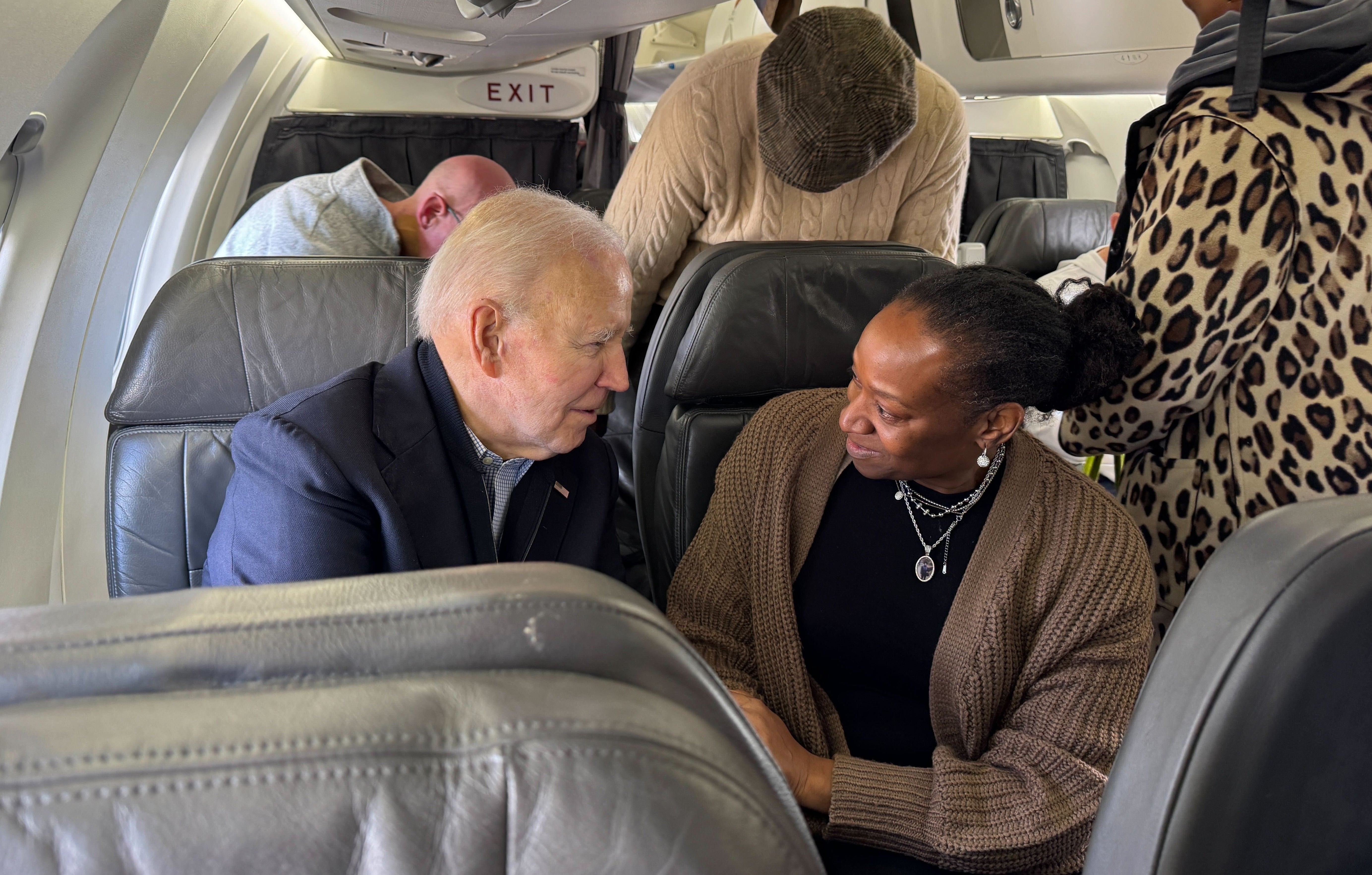 Biden sat in the third row of the small first-class cabin on the commuter jet