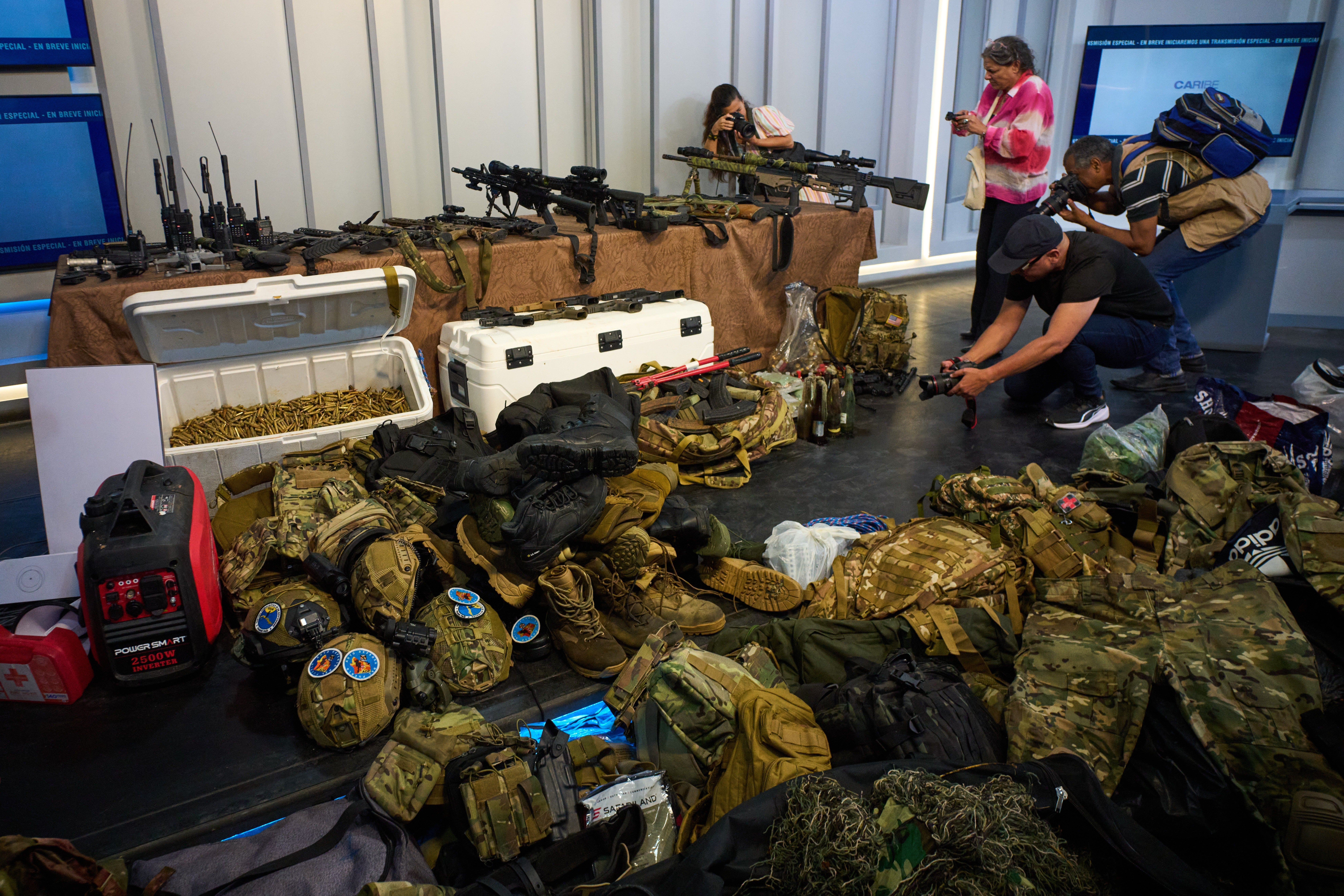 The government unveiled items said to have been found on the boat, including a dozen high-powered weapons, more than 12,800 pieces of ammunition and 11 pistols