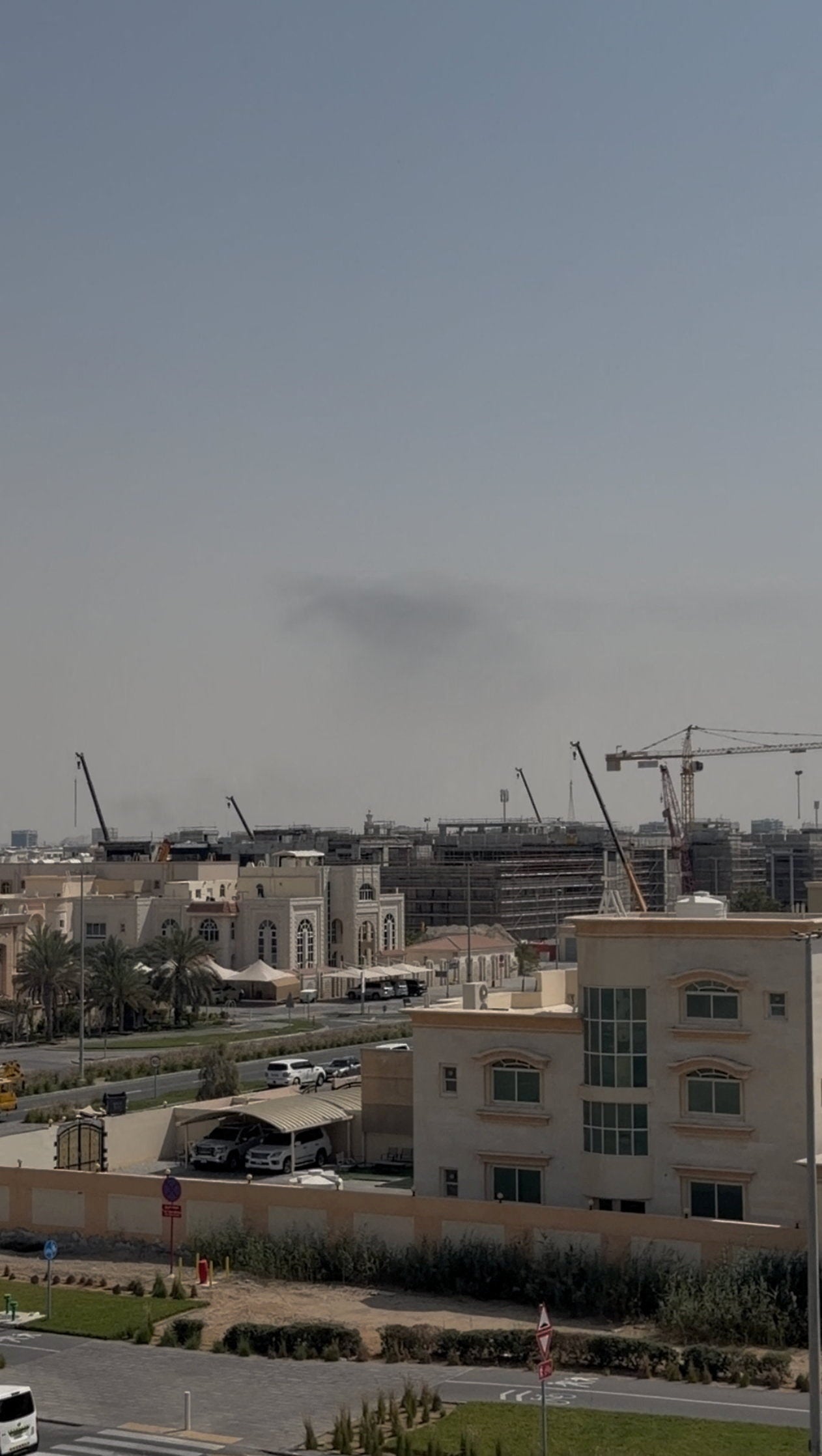 Smoke in the sky after reported blasts were heard, following strikes by the United States and Israel against Iran, in Abu Dhabi, United Arab Emirates, February 28, 2026, in this still image obtained from a video obtained by Reuters.