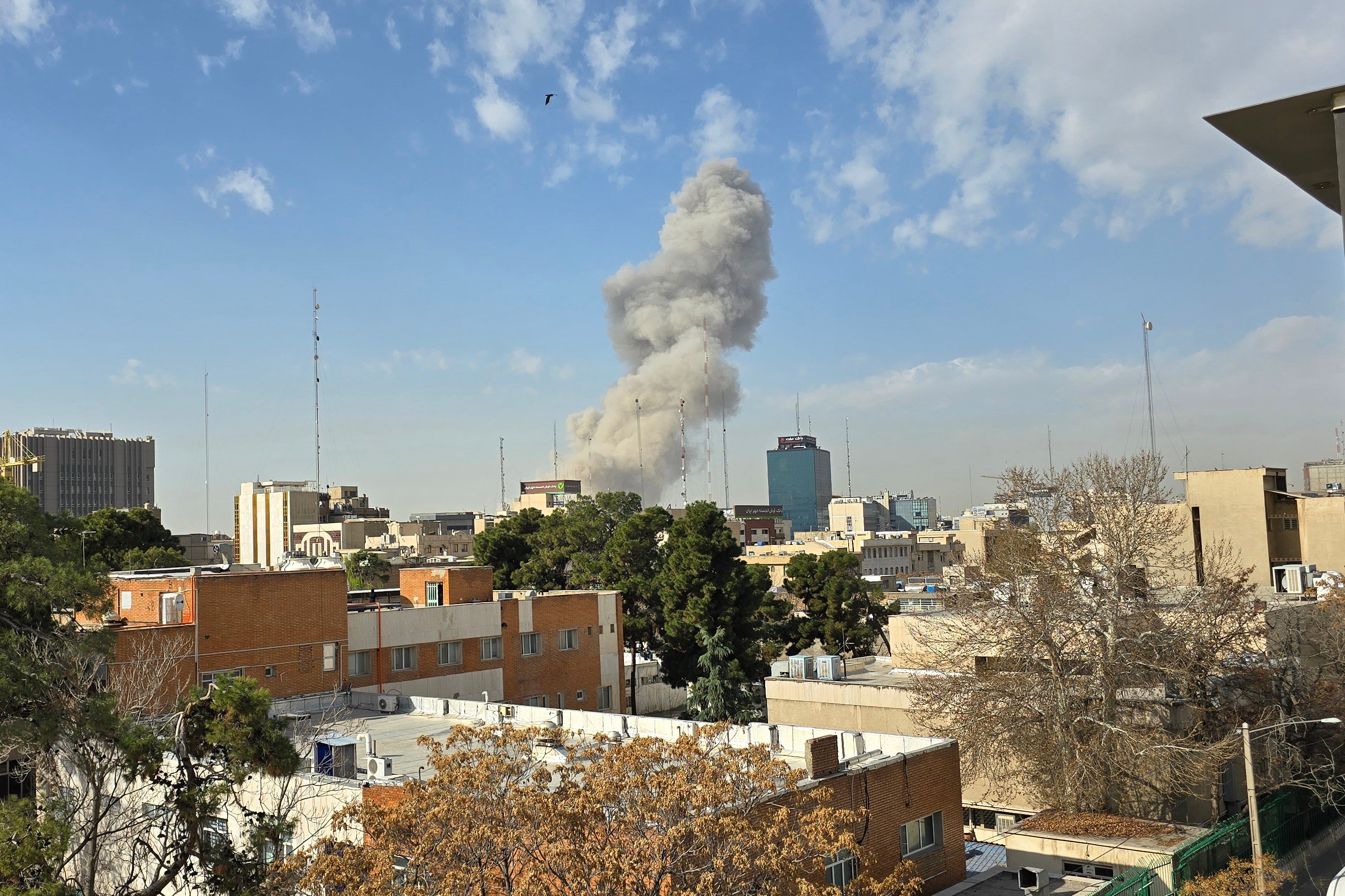 A plume of smoke rises after an explosion on 28 February 2026 in Tehran, Iran