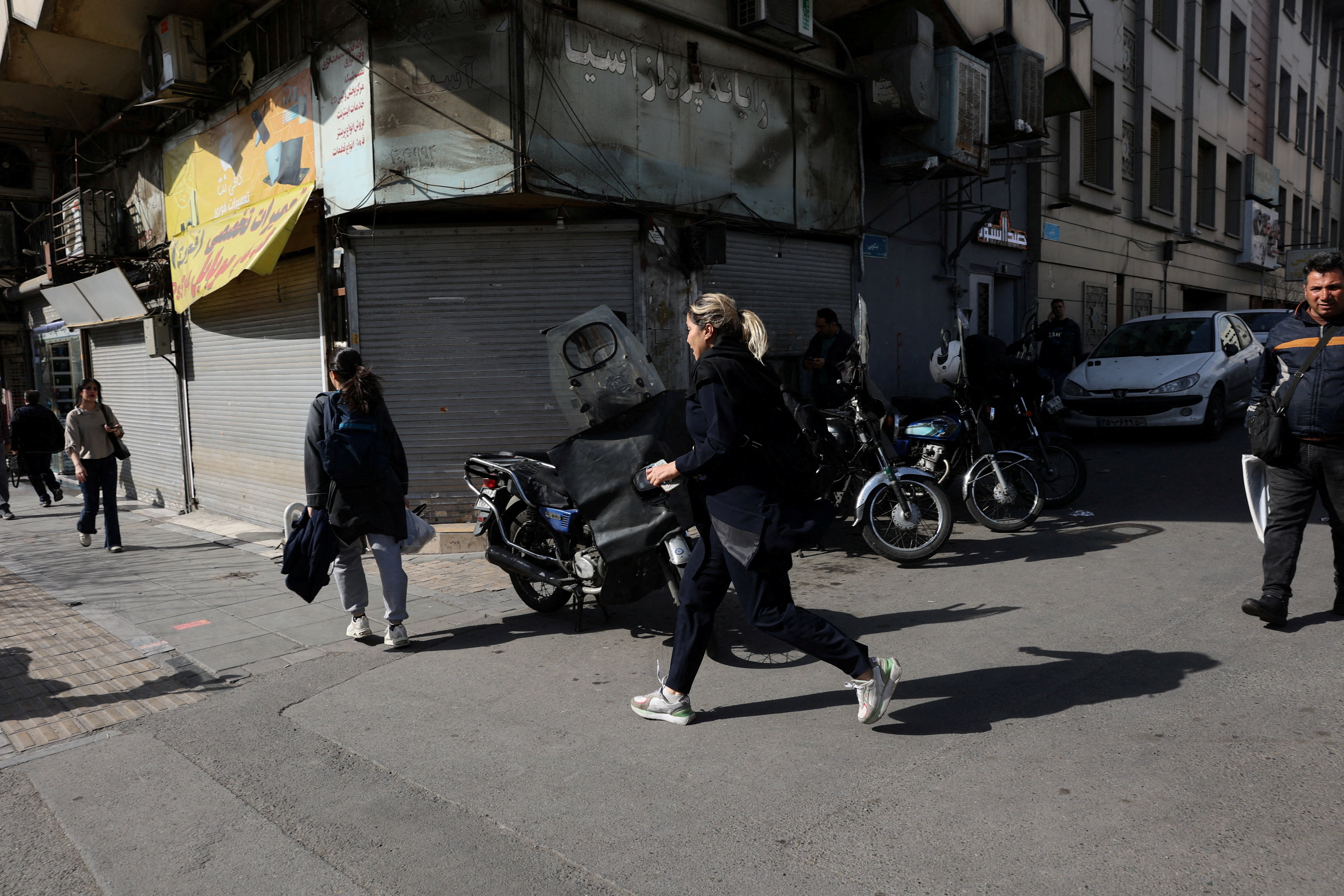 Iranians running for cover in Tehran after Israel launched airstrikes
