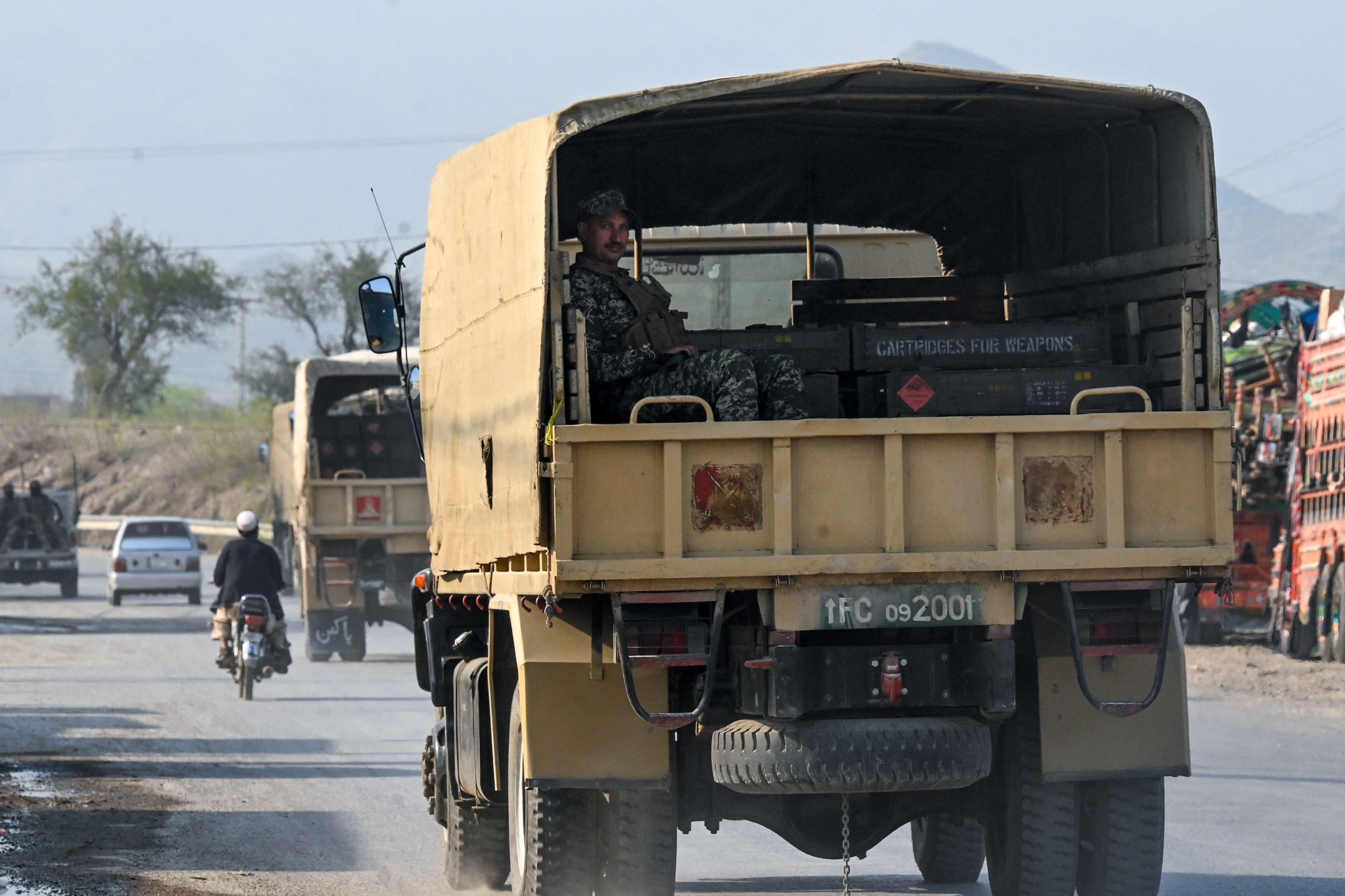 Pakistani army trucks carrying ammunition arrive near the Torkham border between Afghanistan and Pakistan on 28 February 2026