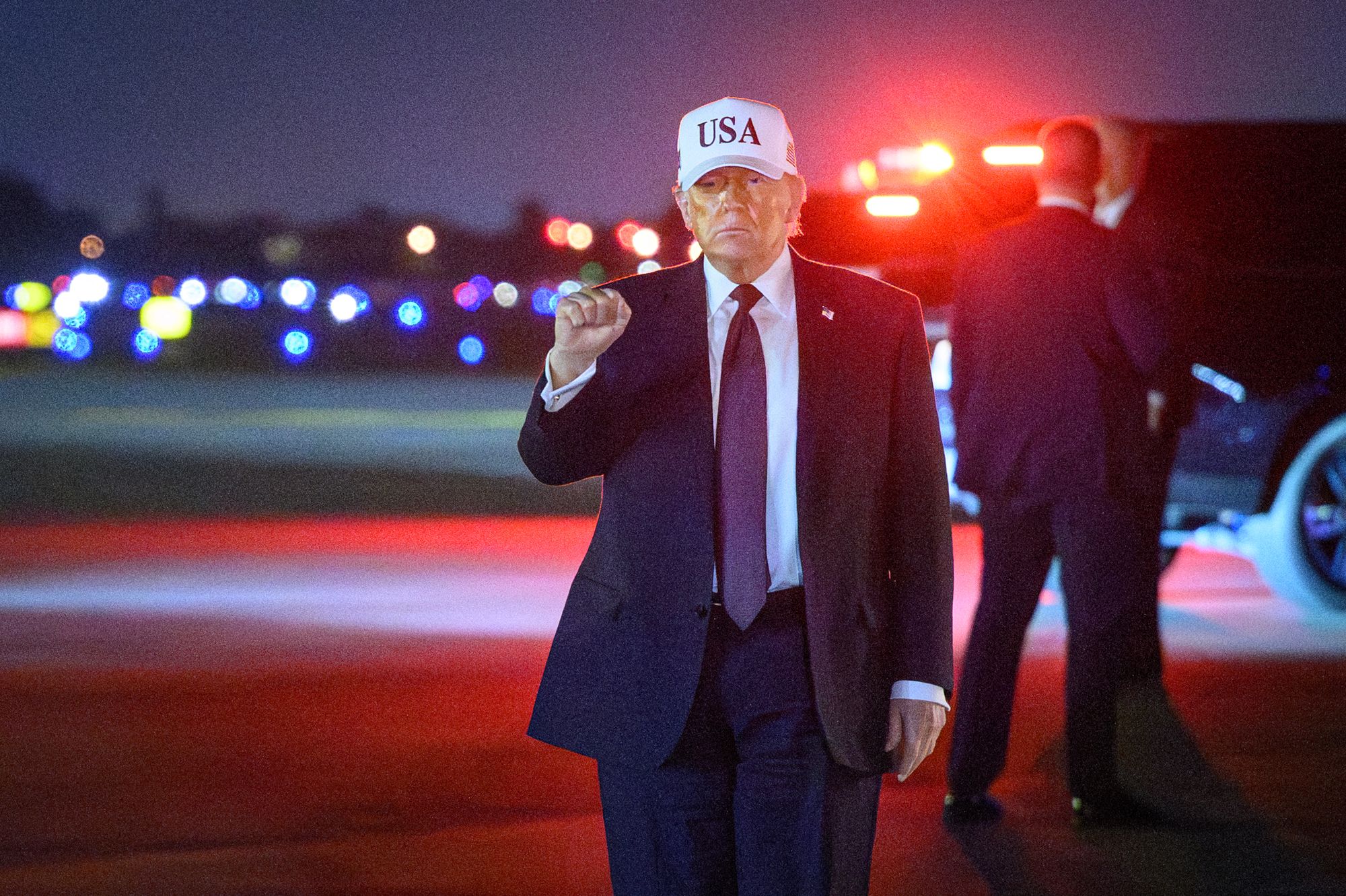 US President Donald Trump gestures as he arrives at Palm Beach International Airport in West Palm Beach, Florida on February 27, 2026.