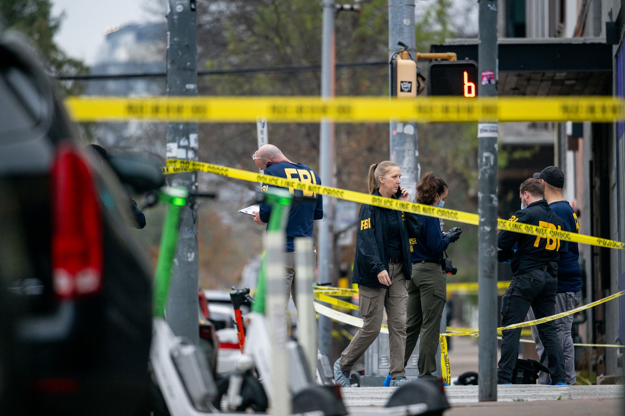 Members of the FBI perform an investigation near Buford's bar in downtown on March 01, 2026 in Austin, Texas. Three people are dead and 14 others hospitalized following a mass shooting early Sunday morning