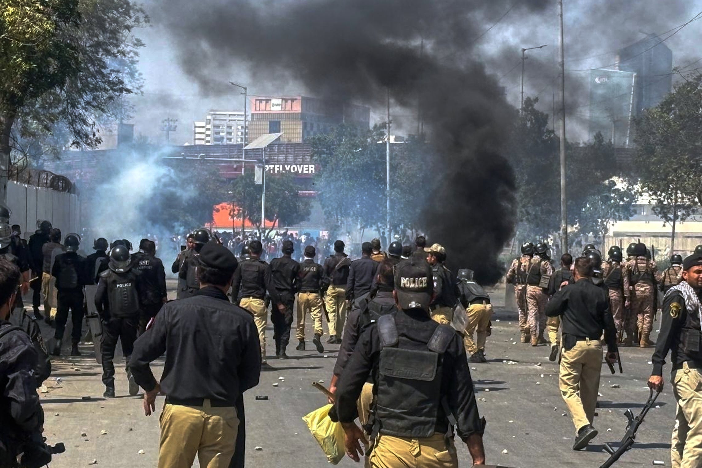 Police chase protesters blocking a road during a demonstration against the assassination of Iran’s supreme leader Ayatollah Ali Khamenei in Karachi, Pakistan, on 1 March 2026