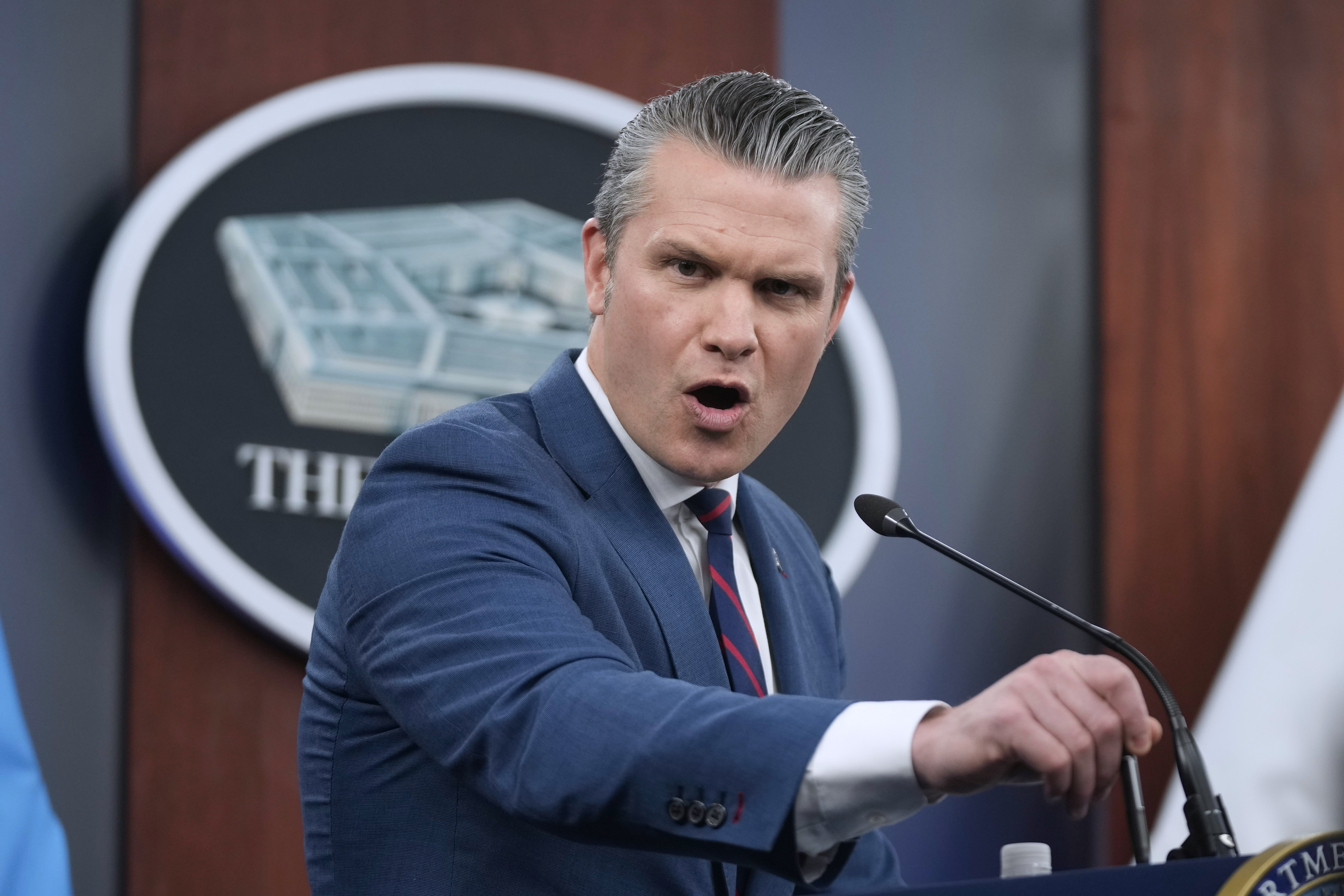 Secretary of Defense Pete Hegseth, pictured at a press briefing Monday, said that the war in Iran will not be a ‘politically correct’ war