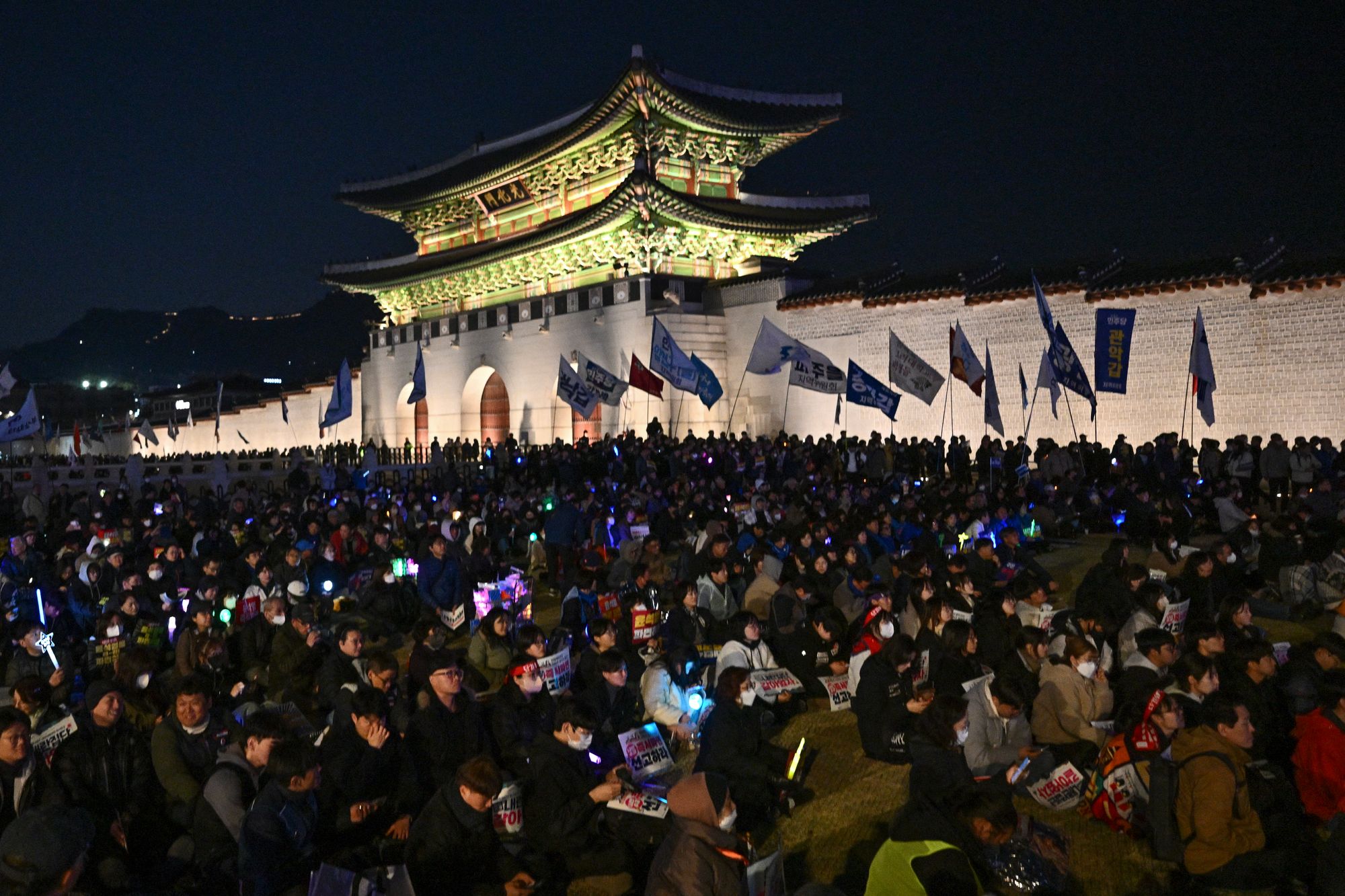 People protest in front of the Gwanghwamun Palace against impeached South Korean president Yoon Suk Yeol in April 2025