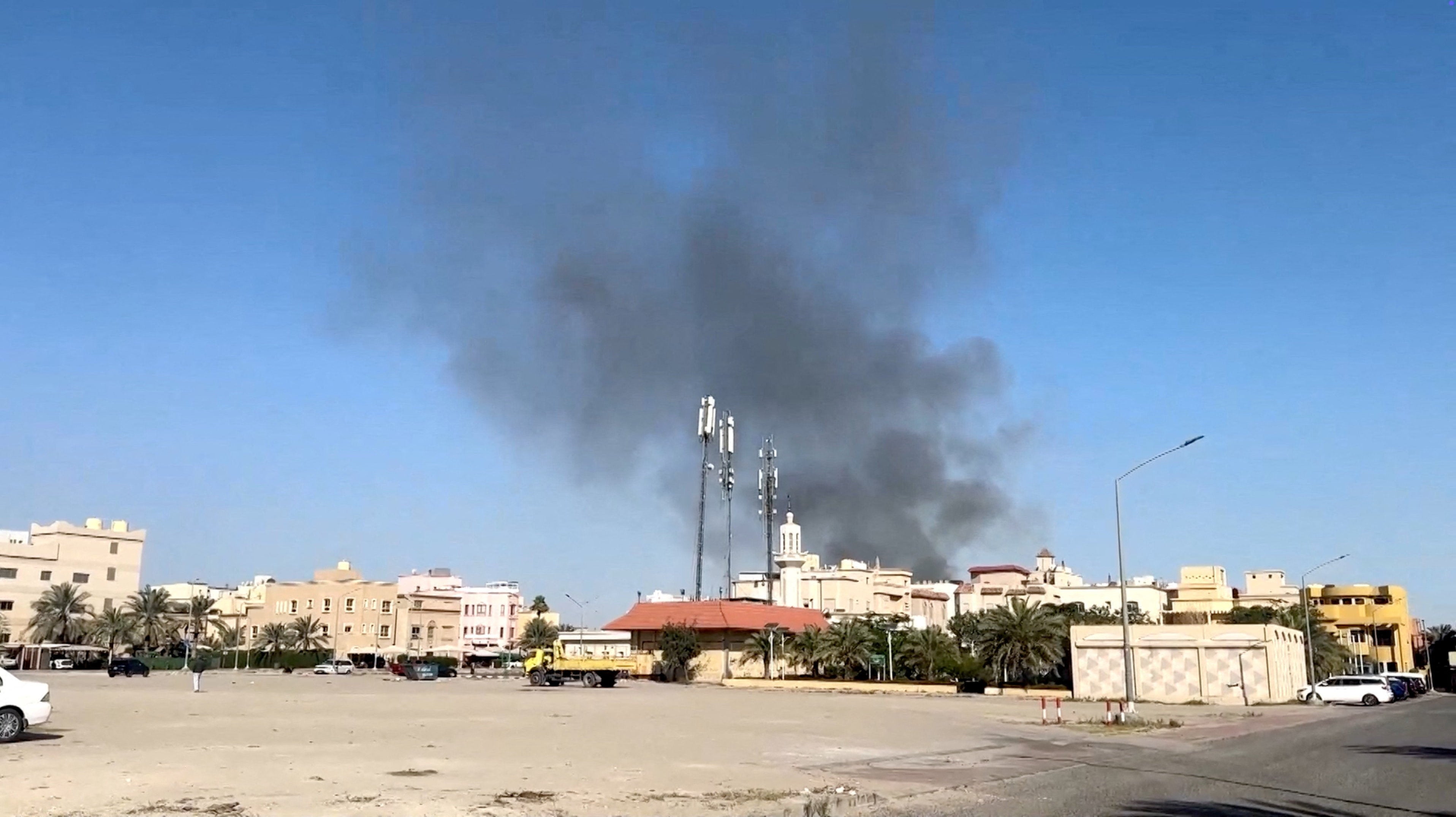 Smoke rises from an area surrounding the U.S. embassy in Bayan, Kuwait