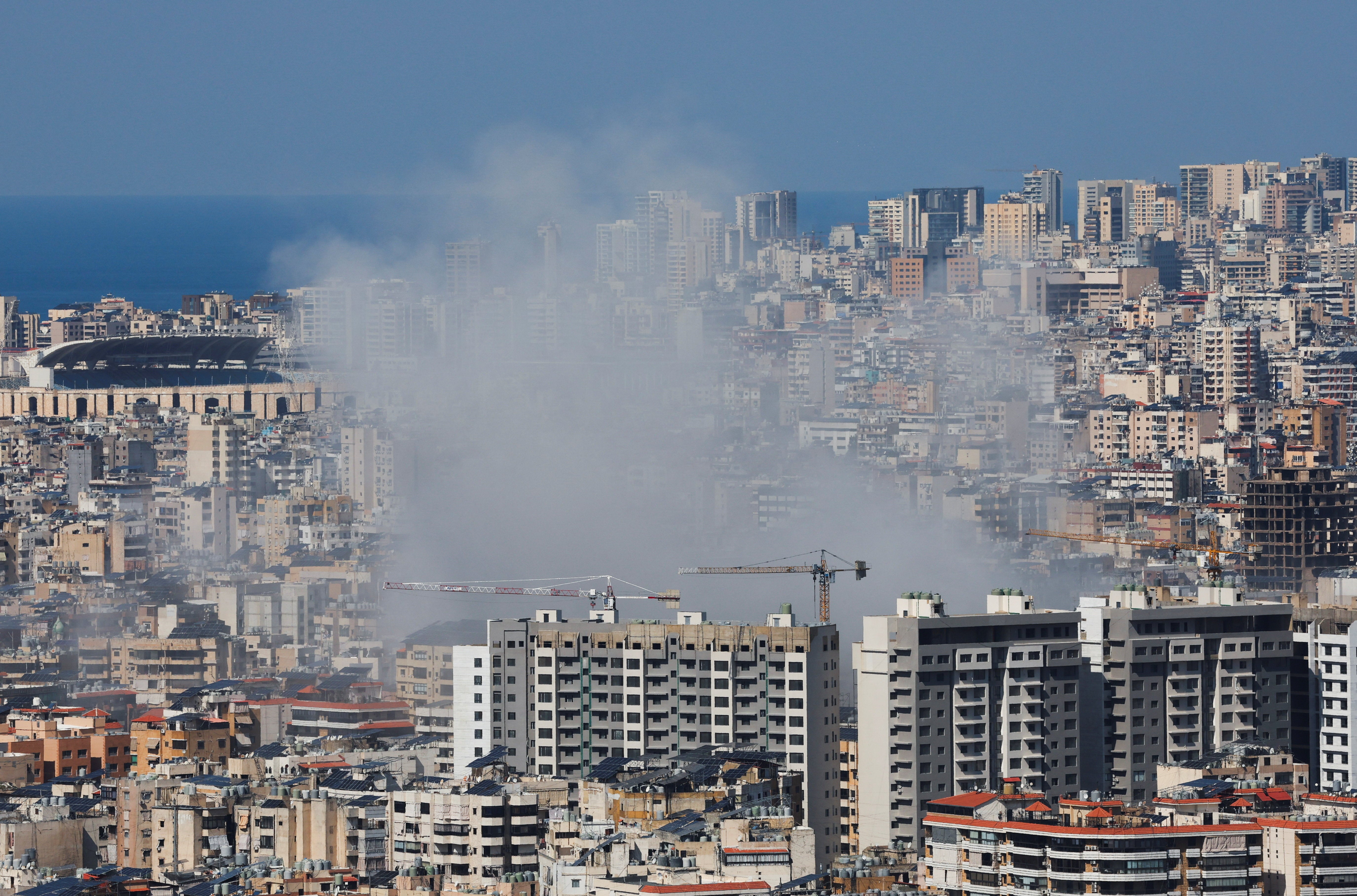 Smoke rises after an Israeli strike on Beirut’s southern suburbs, following an escalation between Hezbollah and Israel on Monday