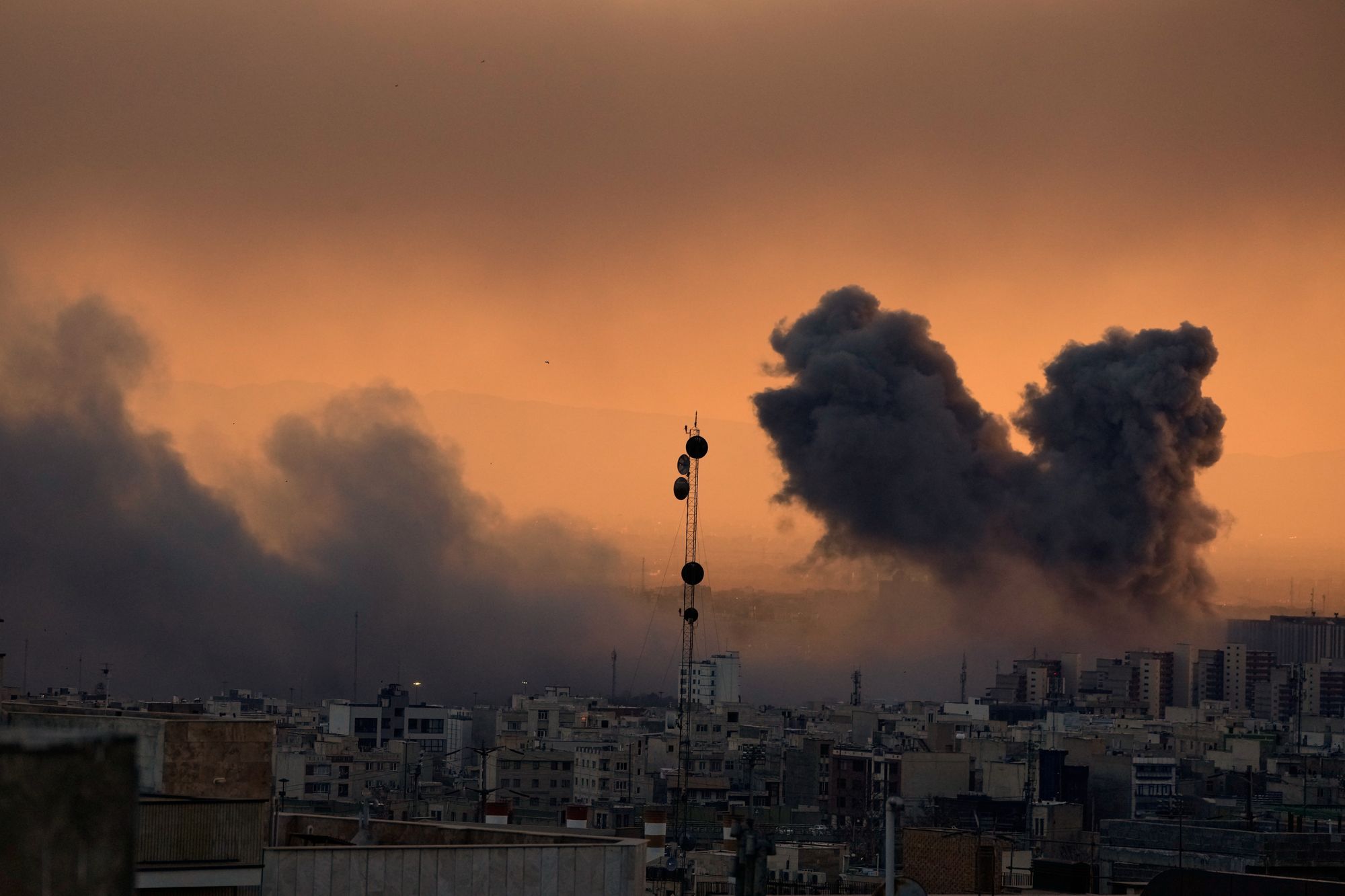 A plume of smoke rises following a U.S.-Israeli military strike in Tehran