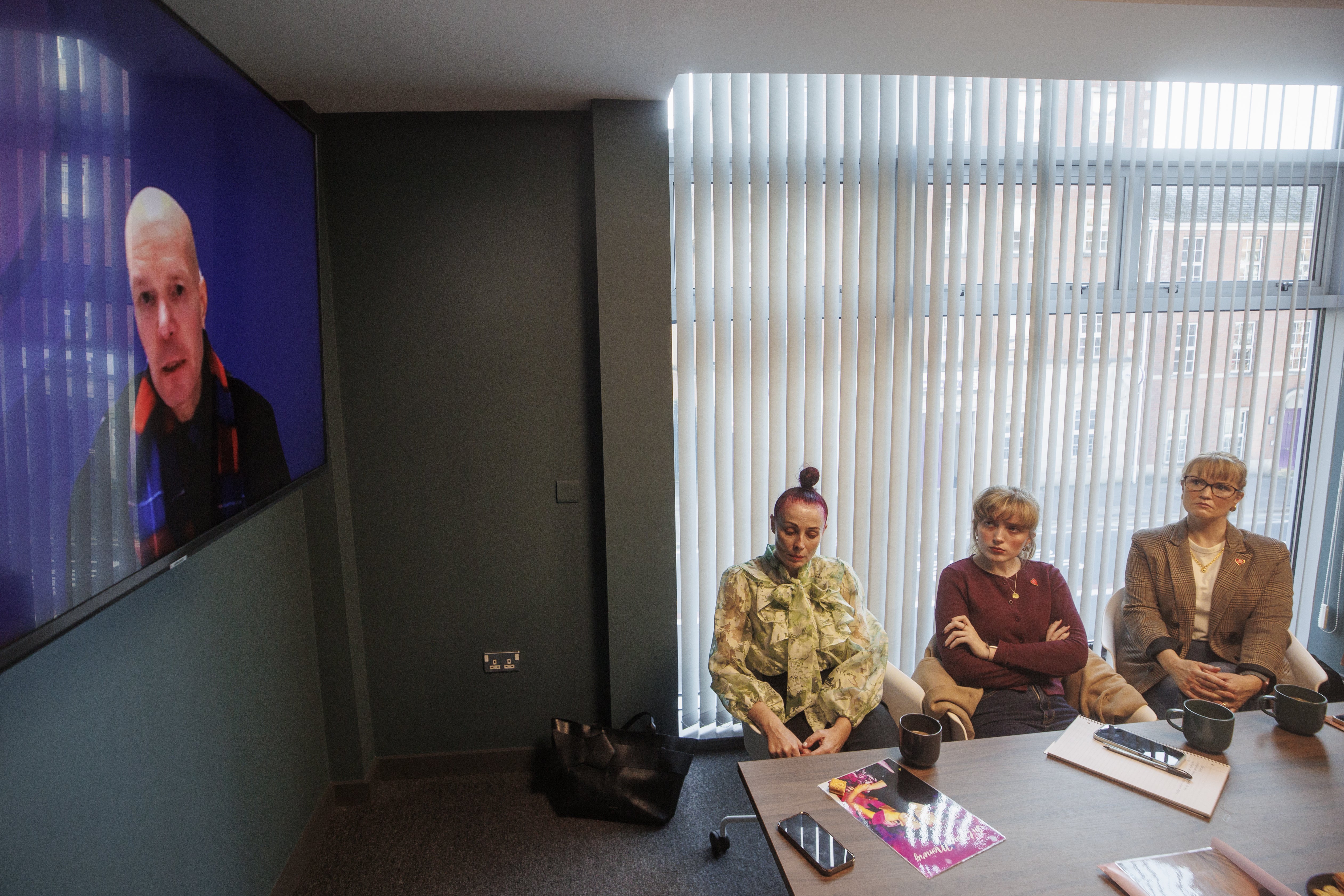Glen Grundle, the son of Milda Grundle, giving evidence as part of the Covid 19 inquiry as (left-right) Martina Ferguson, daughter of Ursula Derry, Lauren Mallon, niece of Raymond McAleese, and Catriona Myles, daughter of Gerry McLarnon, look on in Belfast (Liam McBurney/PA)