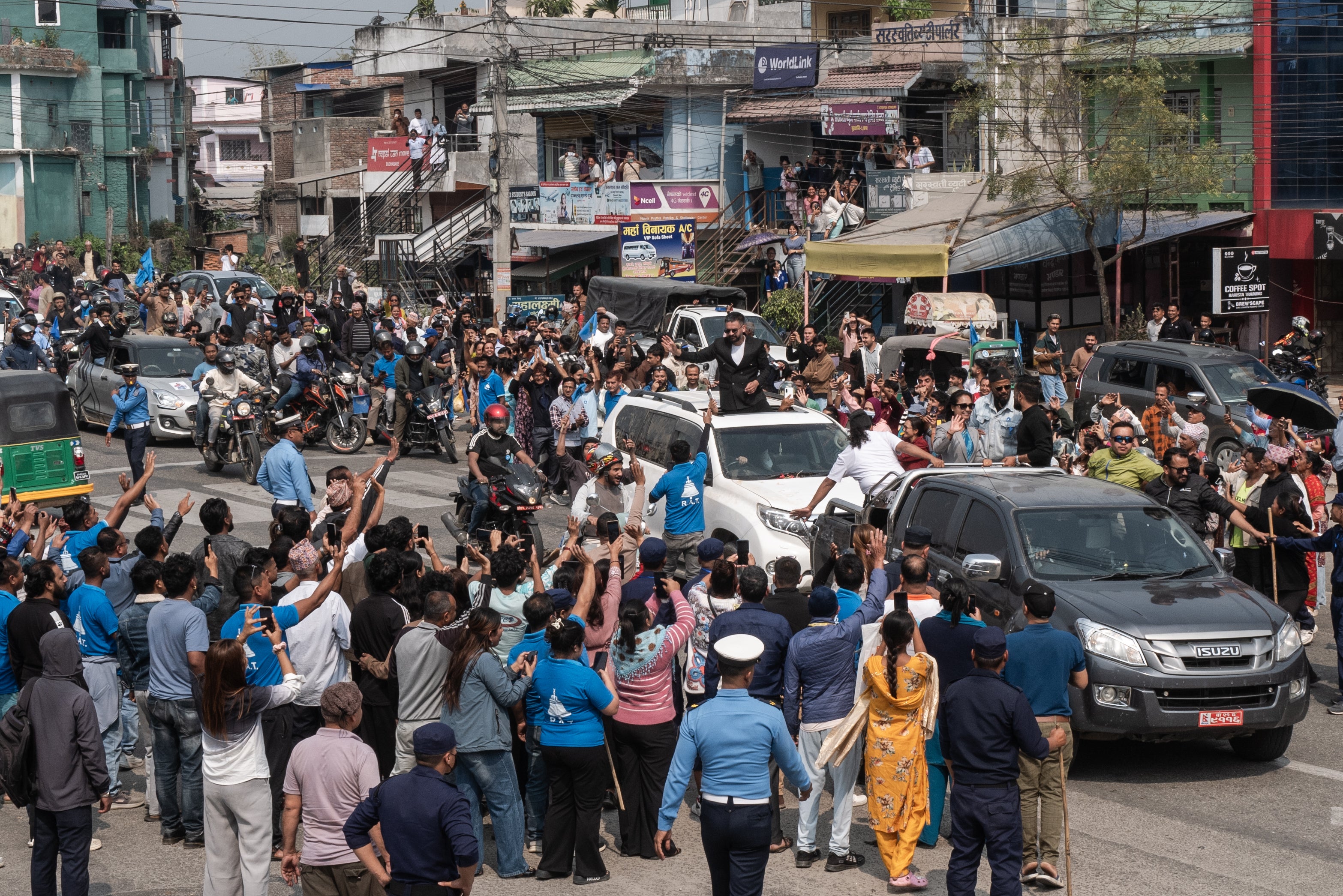 Nepali Rastriya Swatantra Party’s Balendra Shah waves to supporters during a campaign roadshow in the district of Jhapa on 1 March 2026