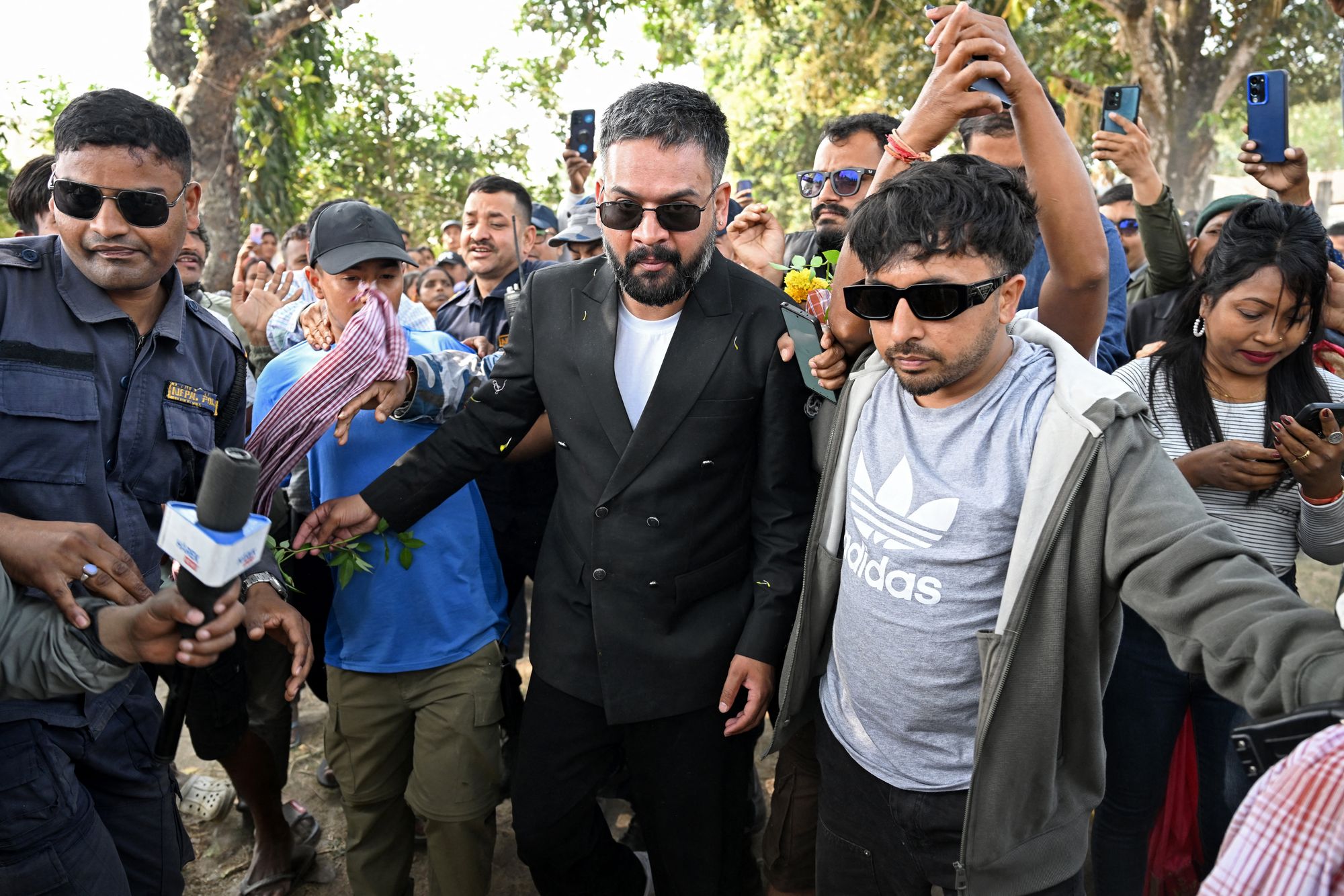 Rastriya Swatantra Party’s Balendra Shah, centre, is greeted by supporters during a rally on the final day of campaigning ahead of Nepal's general election at Gauriganj in Jhapa district on 2 March 2026
