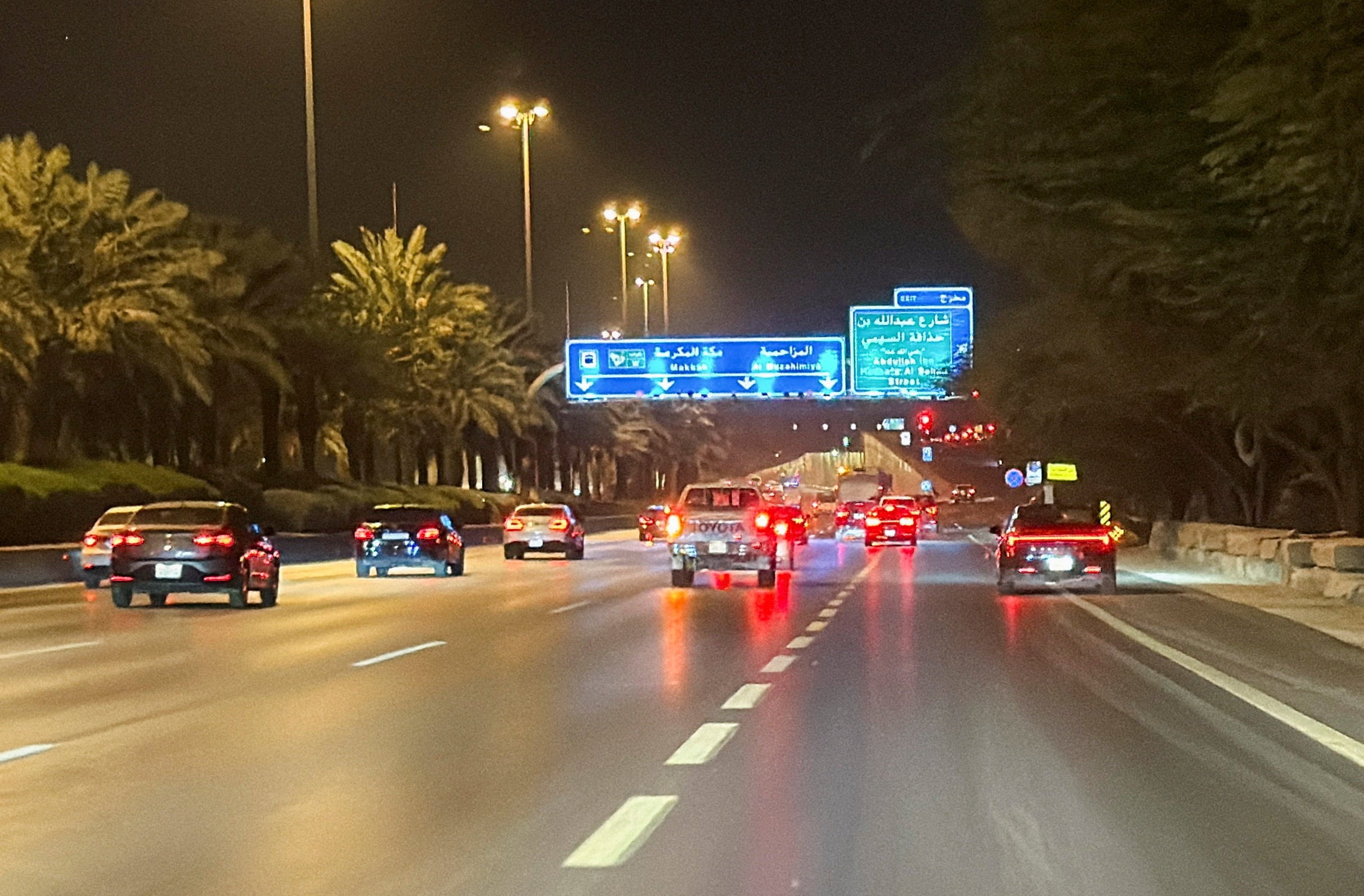 Vehicles drive along a street near the Diplomatic Quarter in Riyadh