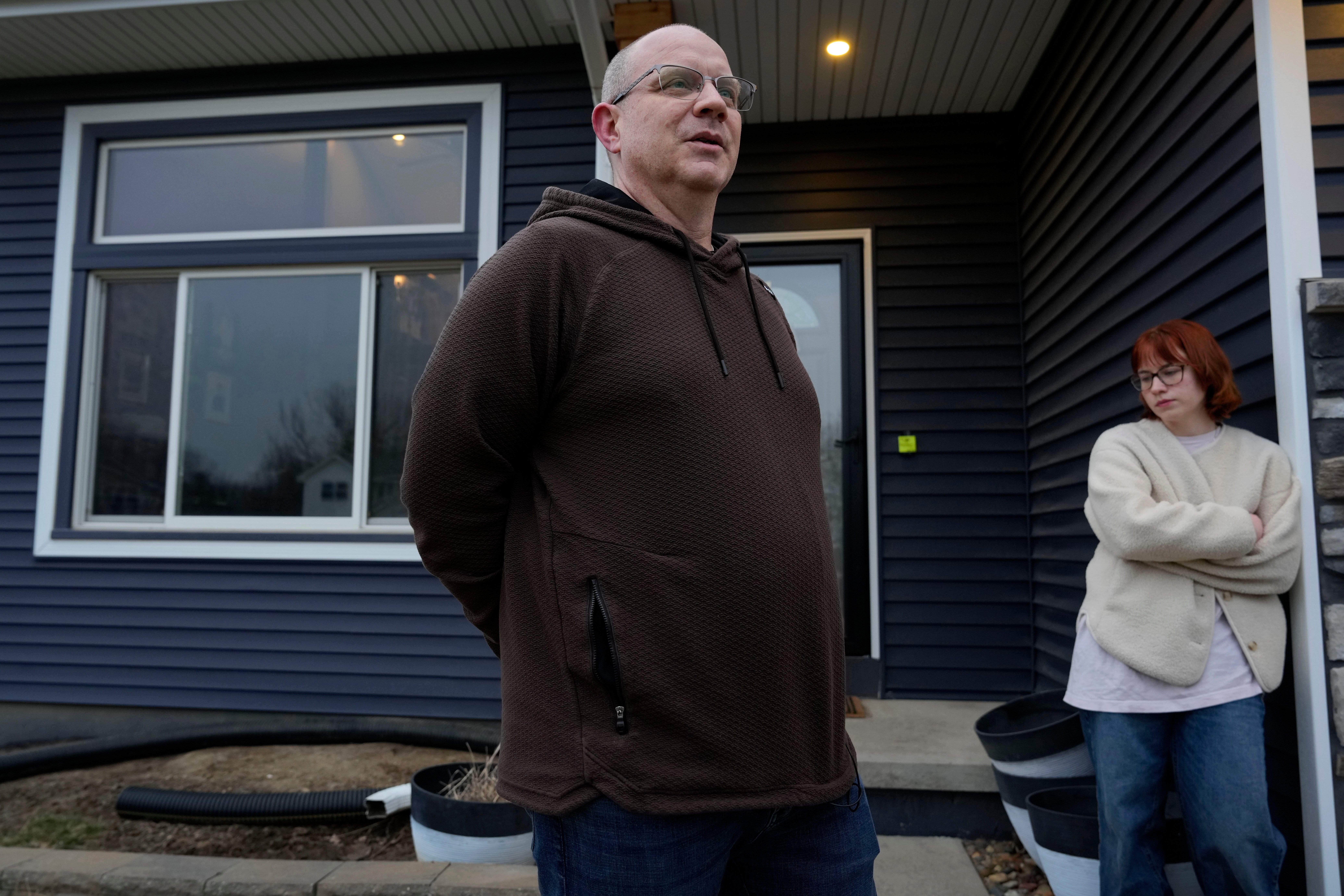 Andrew Coady and his daughter Keira, right, talk about his son, Sgt. Declan Coady, 20, of West Des Moines, Iowa, outside their home, Tuesday, March 3, 2026, in West Des Moines, Iowa.