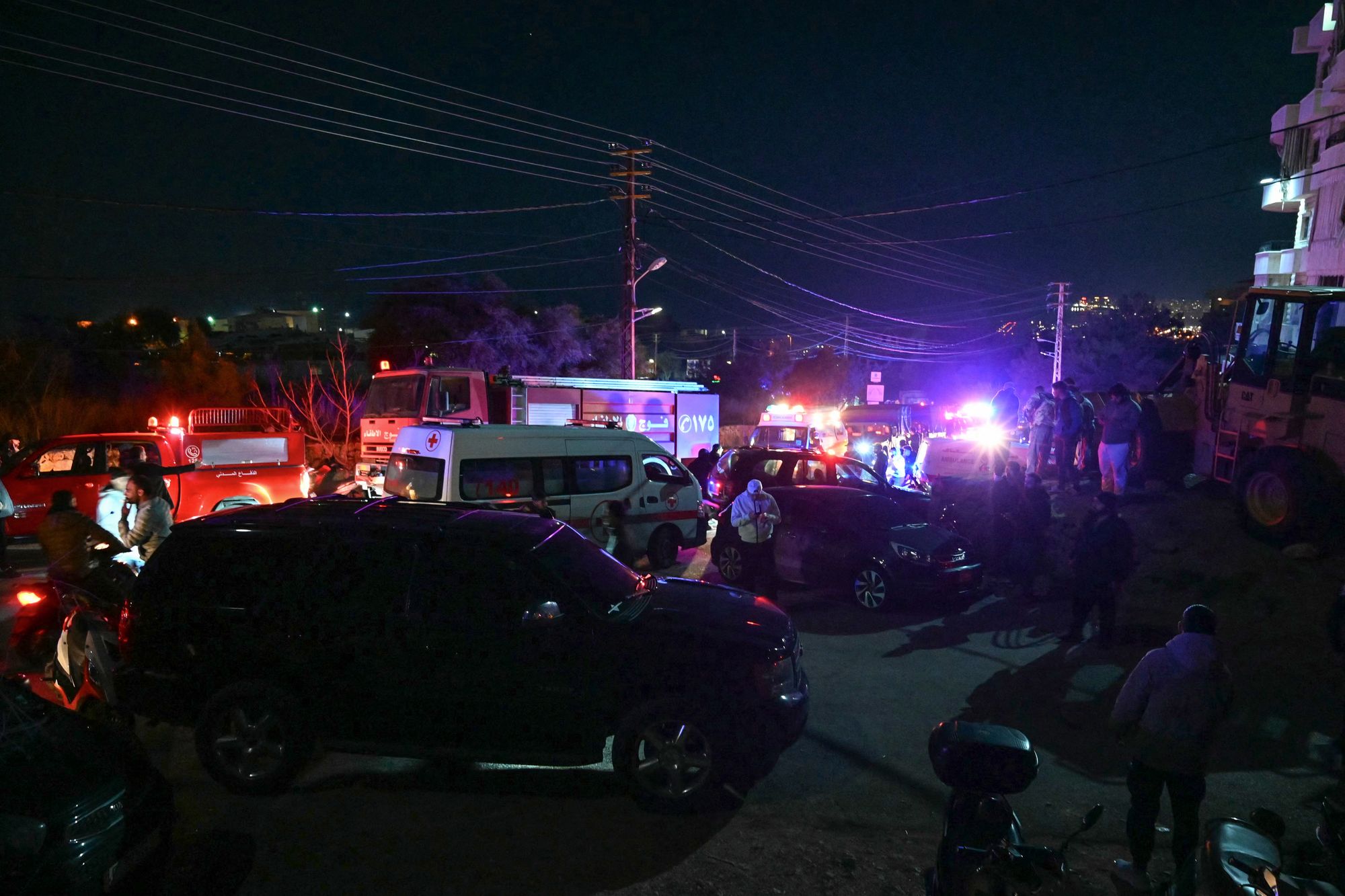 Rescuers are seen at the site of an Israeli airstrike that targeted a building in the town of Aramoun, south of Beirut on 4 March 2026. A loud explosion was heard by an AFP journalist in the Lebanese capital Beirut, shortly after midnight on 4 March as Israel and Hezbollah traded strikes and rocket fire