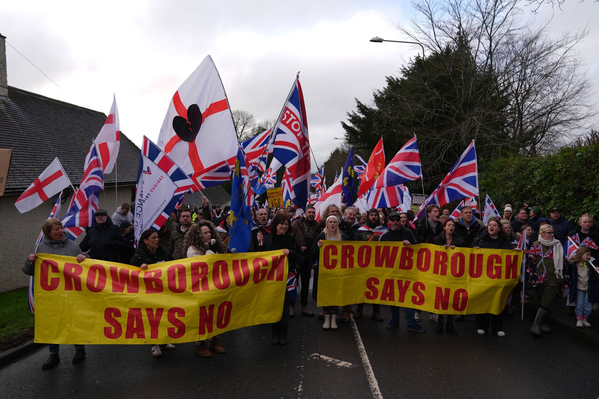 People attend a protest in Crowborough, East Sussex, after the first 27 illegal immigrants were moved to Crowborough Training Camp.
