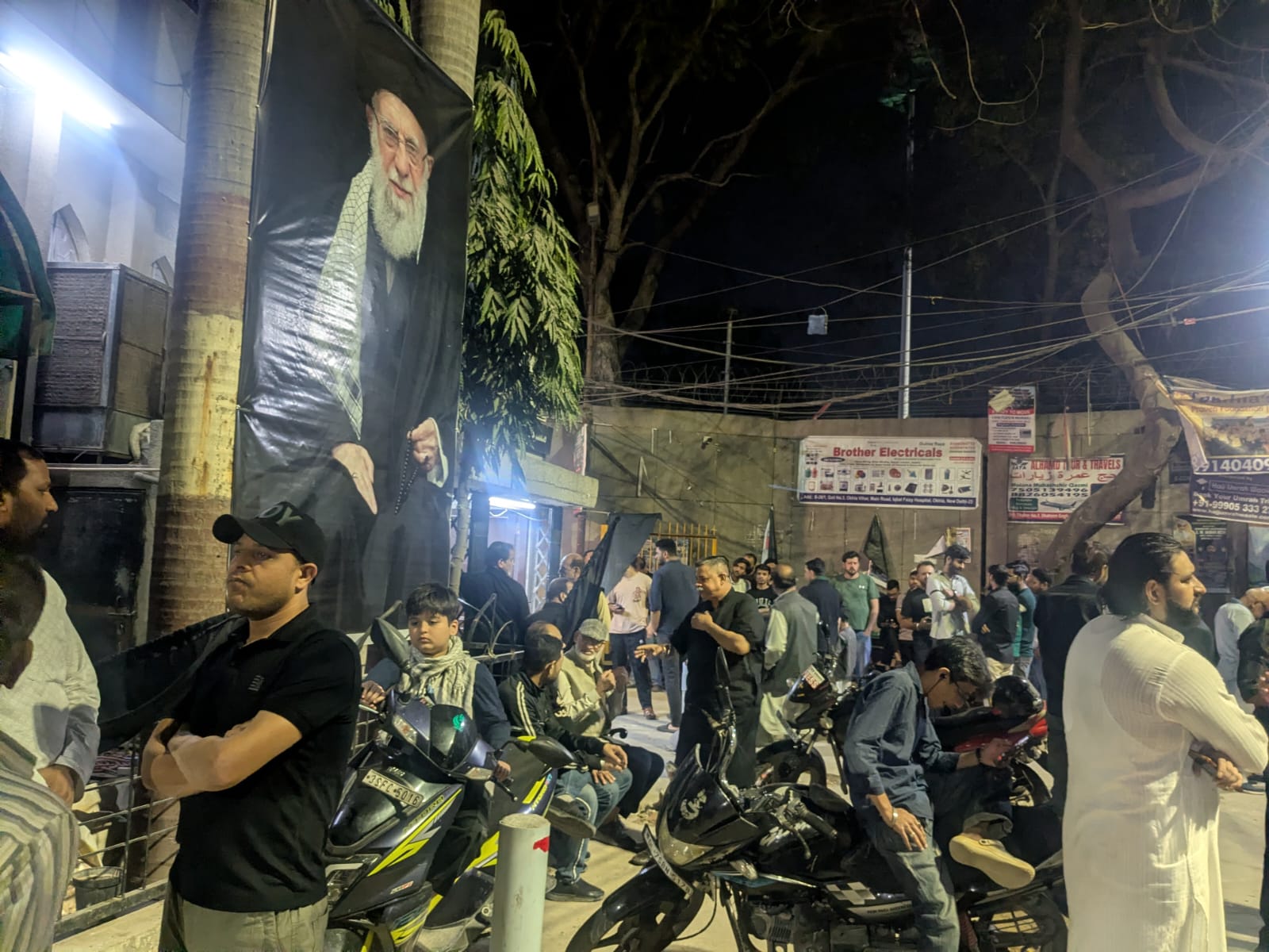 People gather outside Babul Ilm Masjid in Jamia amid police presence