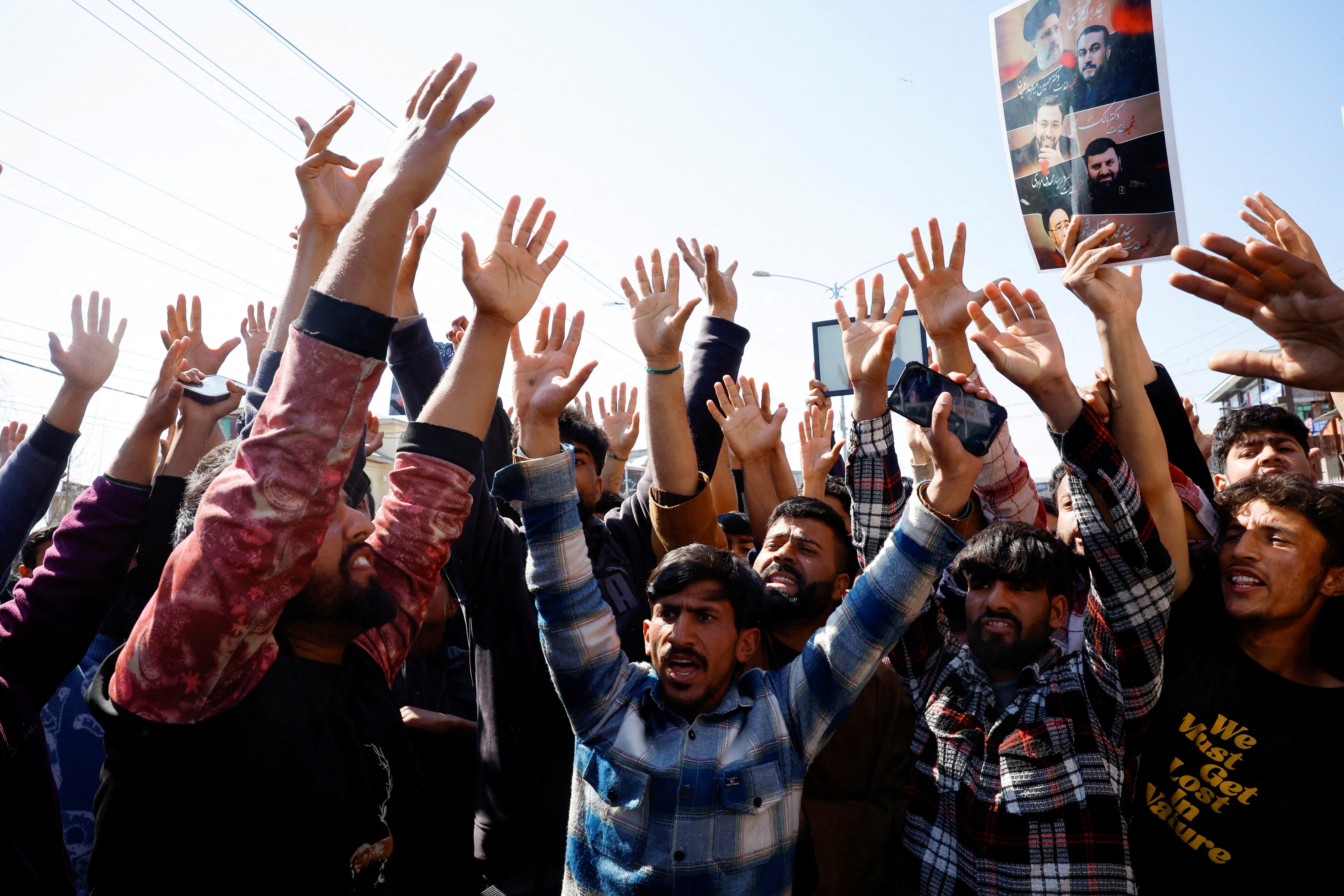 Shi'ite Muslim men protest and chant anti-US and anti-Israel slogans during a demonstration following the killing of Iran's supreme leader Ayatollah Ali Khamenei in Israeli and US strikes on Saturday, in Magam town, Central Kashmir
