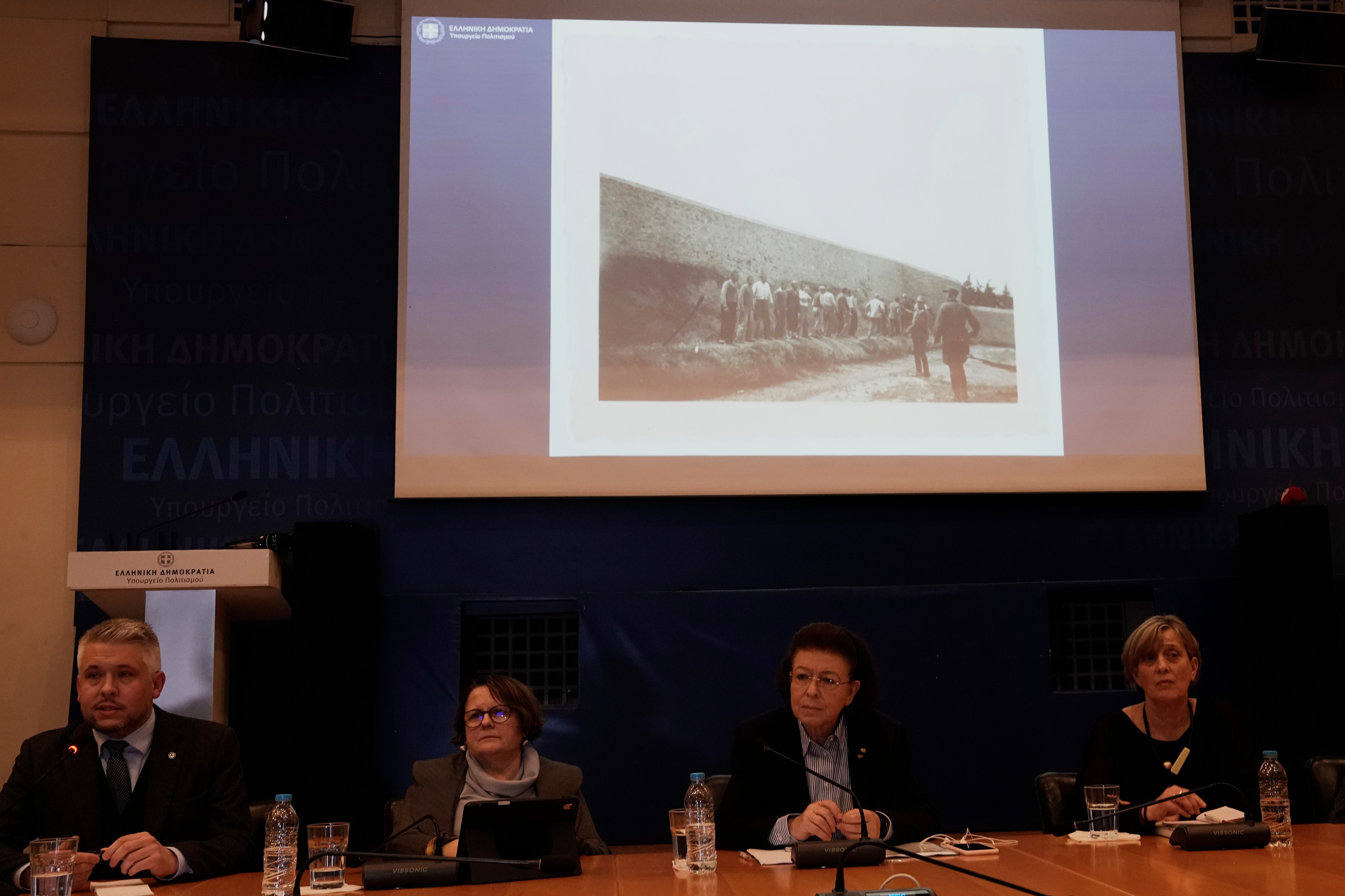 Photographs showing the final moments of Greek prisoners before their execution by Nazi forces at the Kaisariani firing range in Athens on May 1, 1944, are presented by Greece's Culture Minister Lina Mendoni, second right, after the state acquired the wartime archive, in Athens on Thursday, March 5, 2026. (AP Photo/Thanassis Stavrakis)