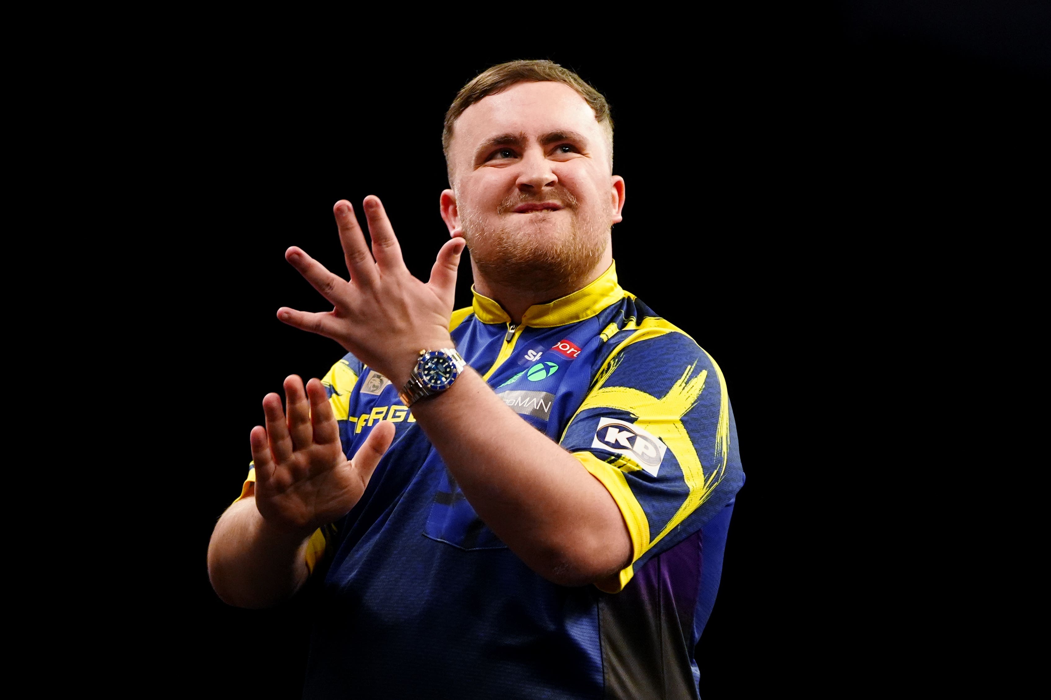 Luke Littler reacts during his Premier League victory on night five in Cardiff (David Davies/PA)