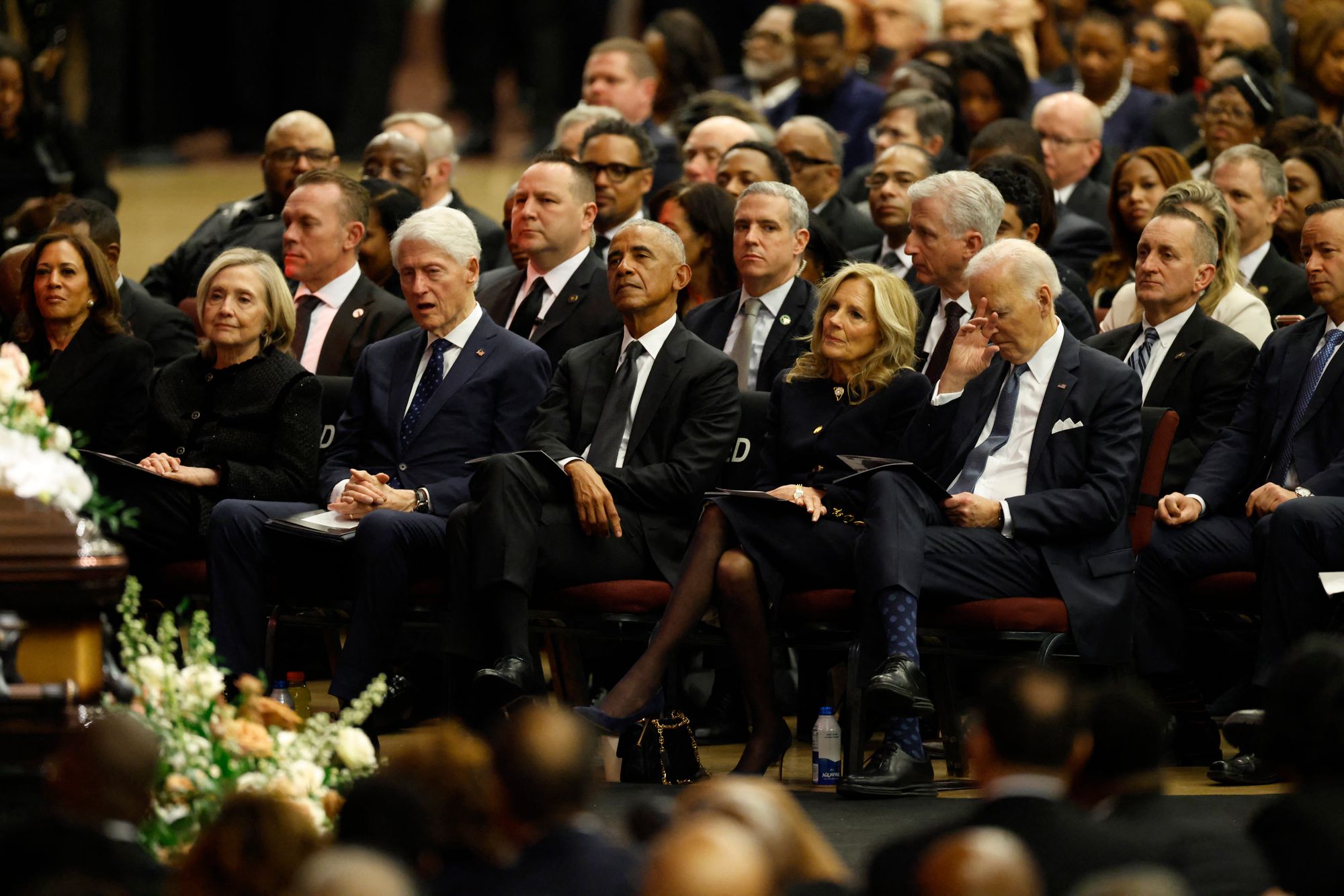 Kamala Harris and Hillary Clinton were also seated in the front row beside Bill Clinton, Barack Obama, Jill Biden and Joe Biden