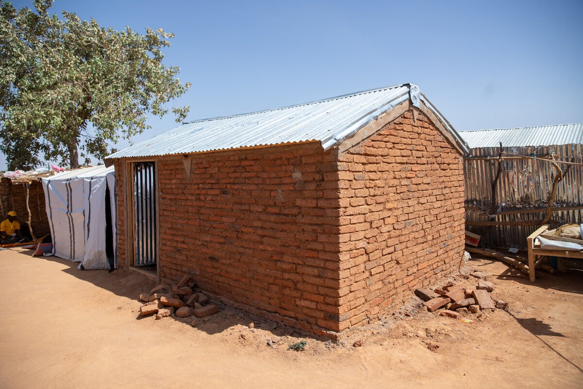 Hawa's semi-permanent shelter, with reinforced walls and a lockable door
