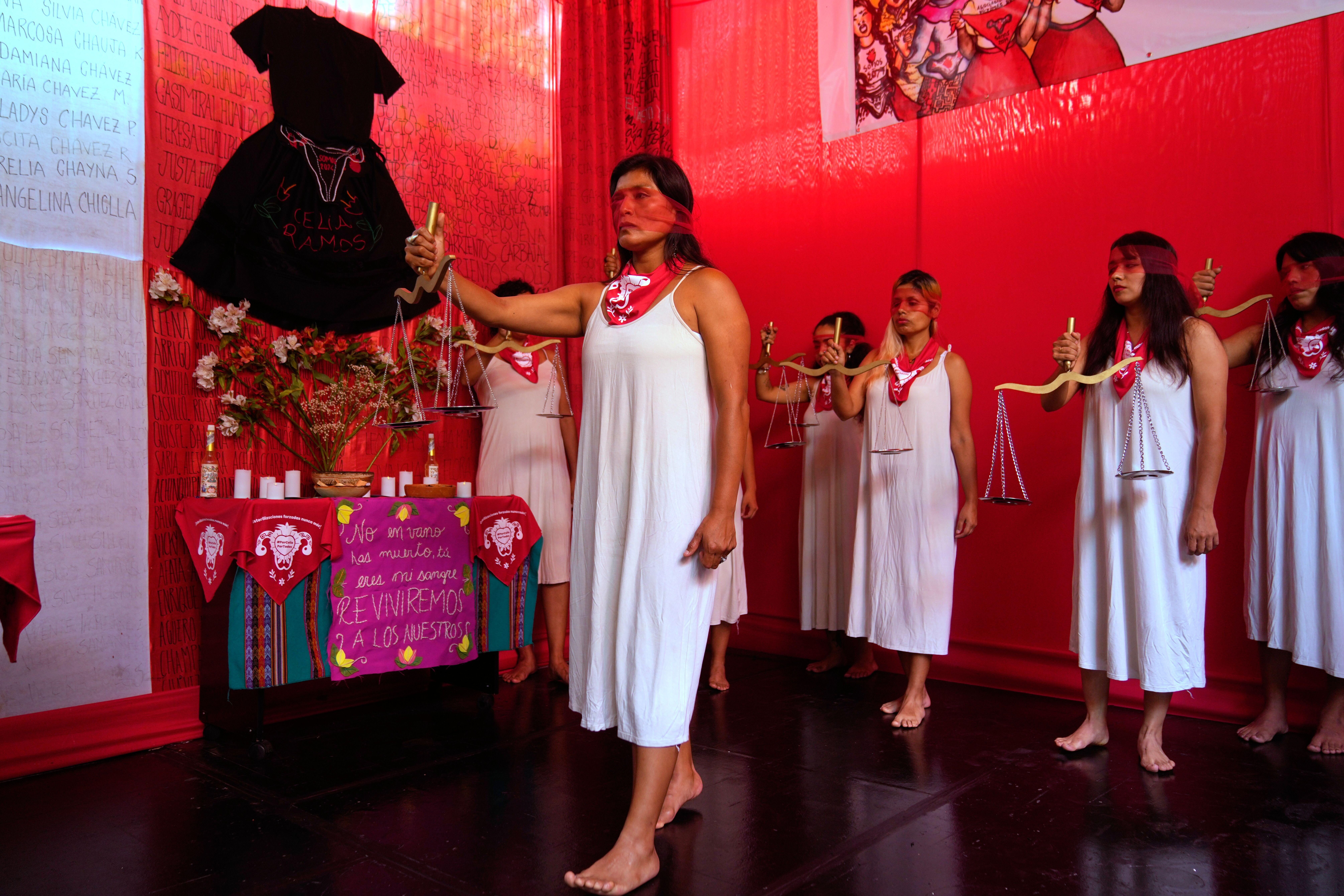 Demonstrators perform representing the female victims of a forced sterilization program under the administration of late Peruvian President Alberto Fujimori in Lima, Peru, Friday, March 6, 2026