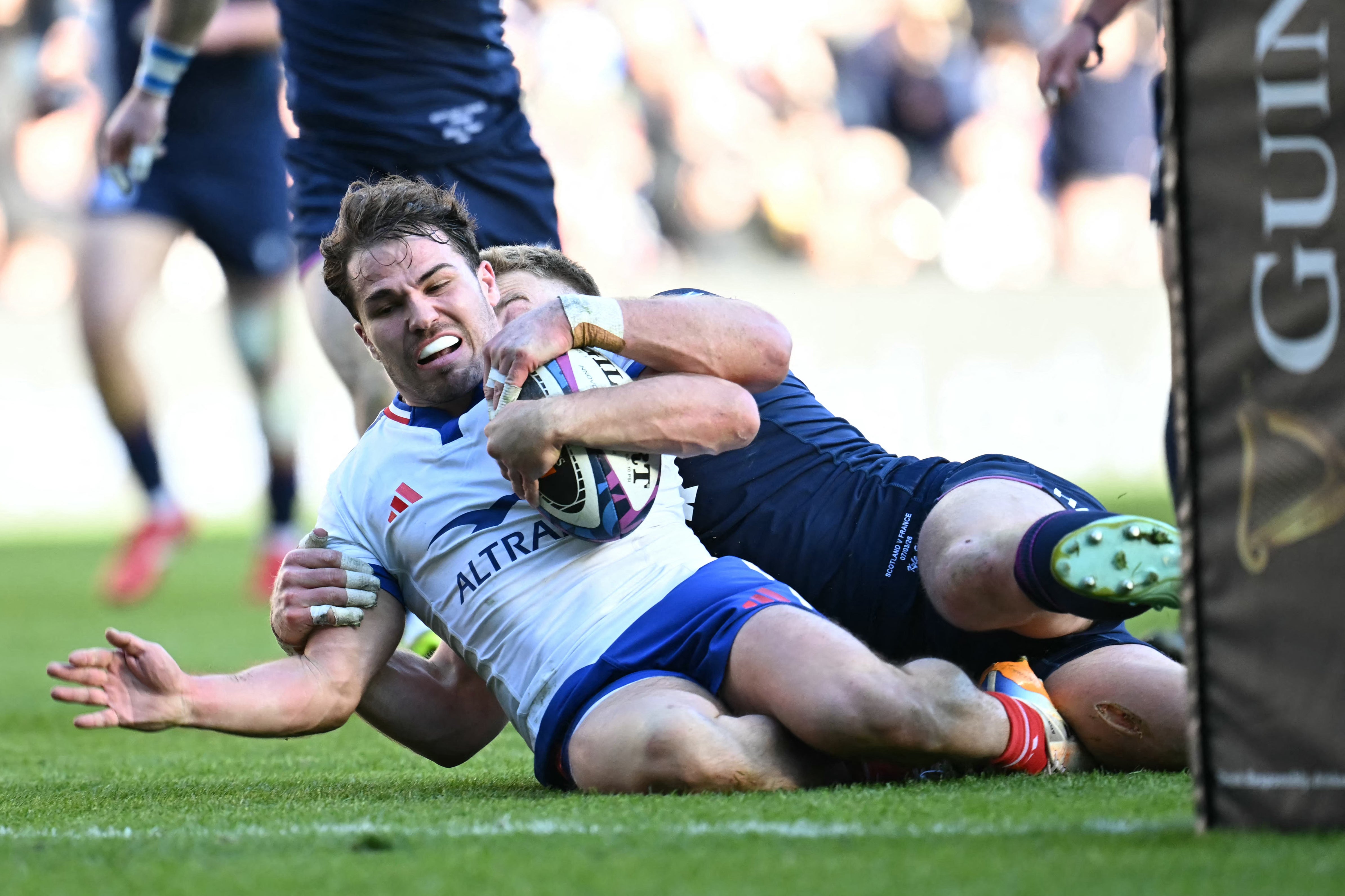 France’s scrum-half Antoine Dupont scored a try