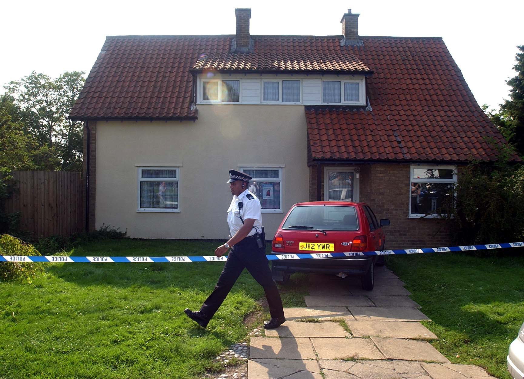 Police officers sealed off the Soham home of caretaker Ian Huntley and his partner Maxine Carr