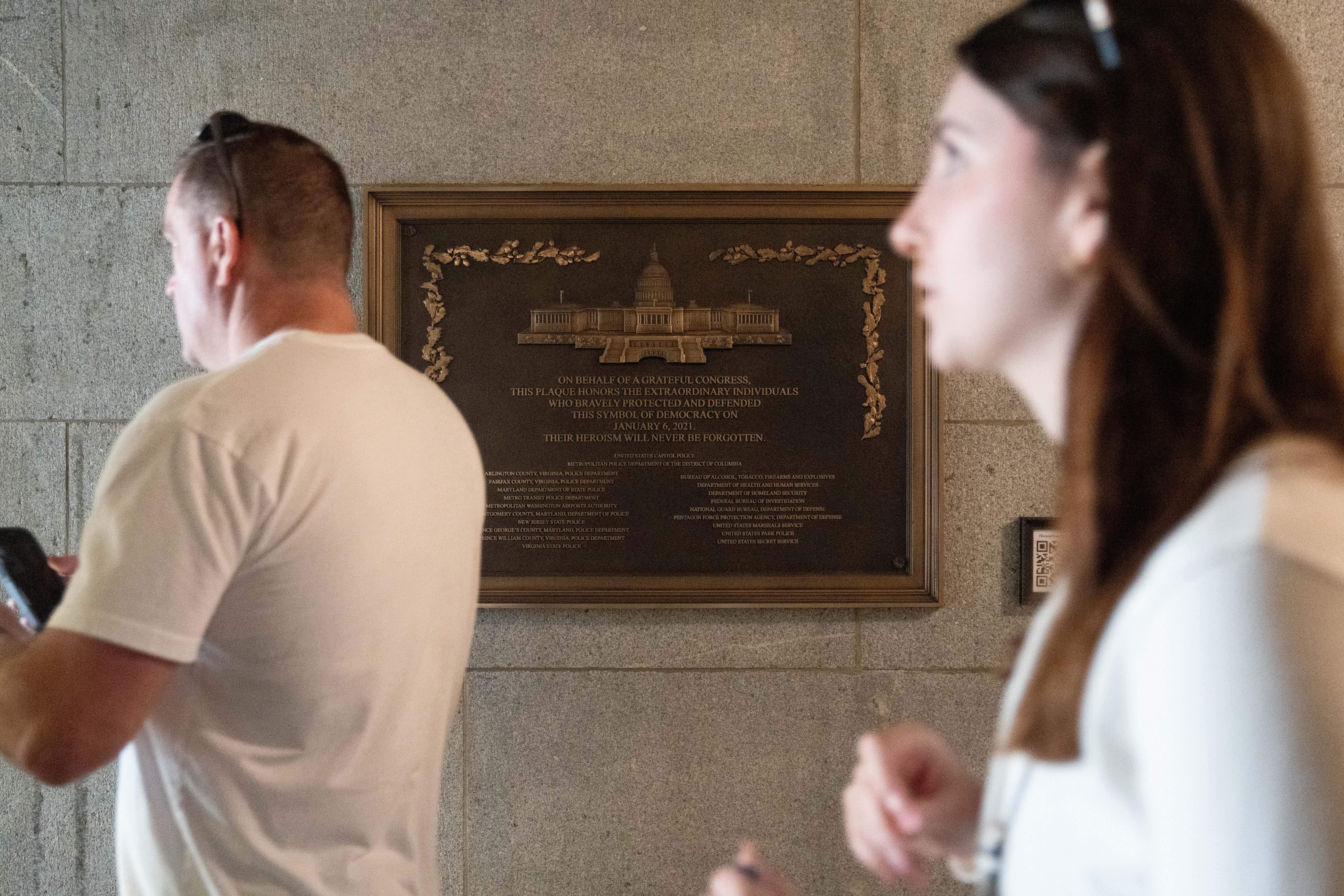 It was bolted to a granite wall near an entrance on the west front of the Capitol staff with the Architect of the Capitol close to the site of where the demonstrators had swarmed the building while lawmakers cowered inside almost five years previously