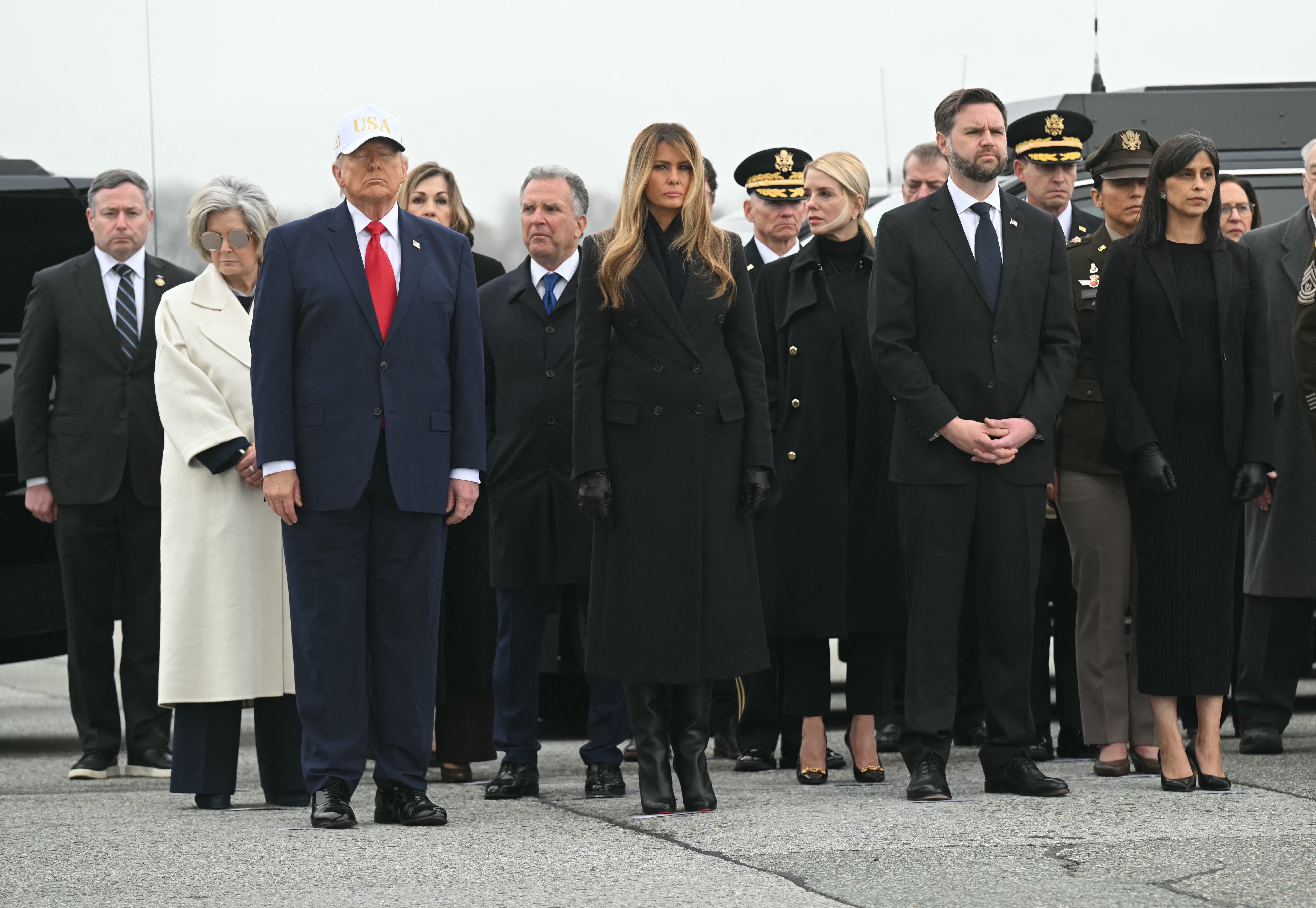 White House chief of staff Susie Wiles, US President Donald Trump, special envoy Steve Witkoff, First Lady Melania Trump, Attorney General Pam Bondi, Vice President JD Vance and Second Lady Usha Vance attend a dignified transfer solemn event at Dover Air Force Base, in Dover, Delaware