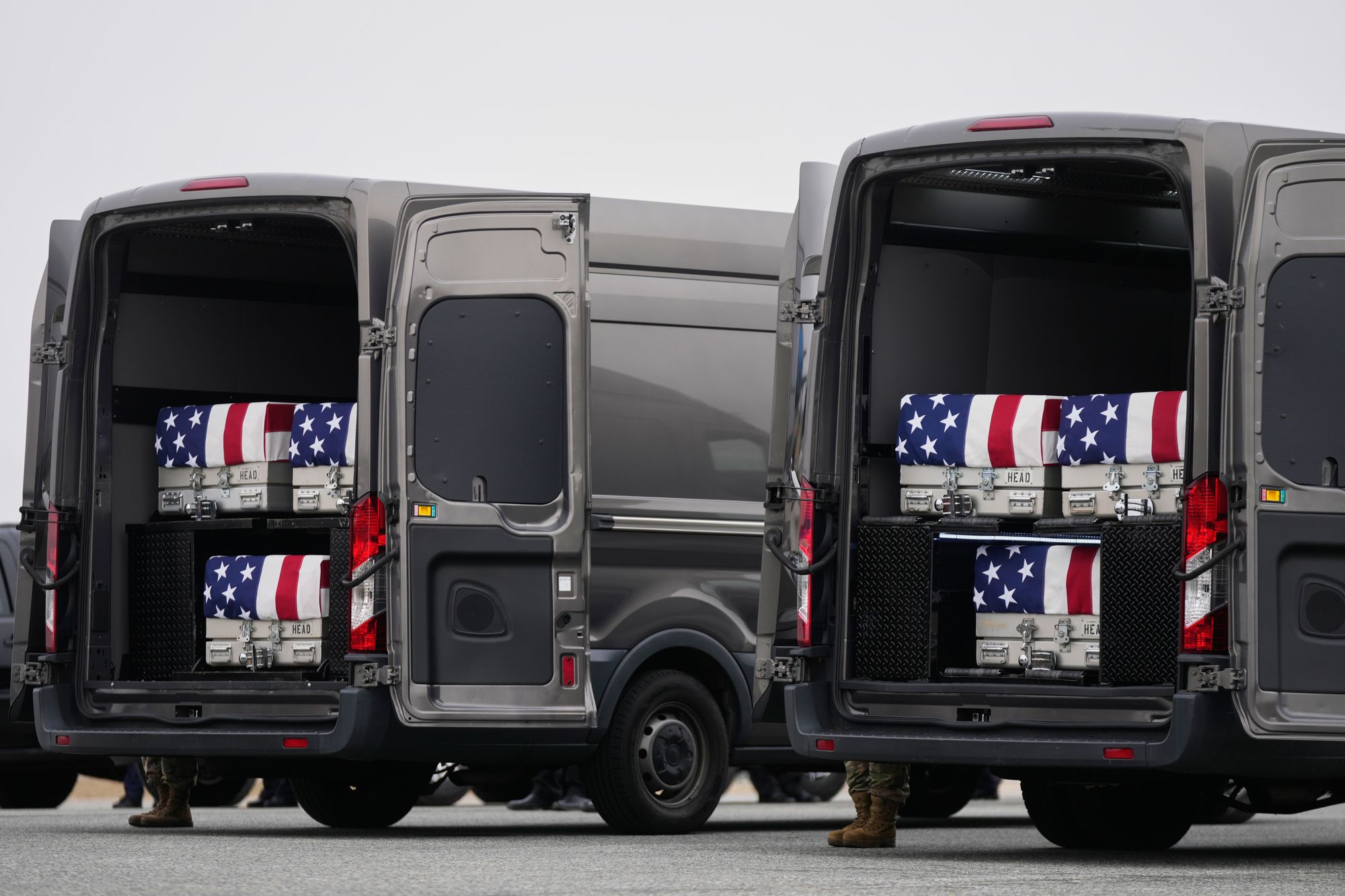 During the ritual, transfer cases draped with the American flag and holding the remains of the fallen soldiers are carried from the military aircraft that transported them to an awaiting vehicle to take them to the mortuary facility at the Delaware base