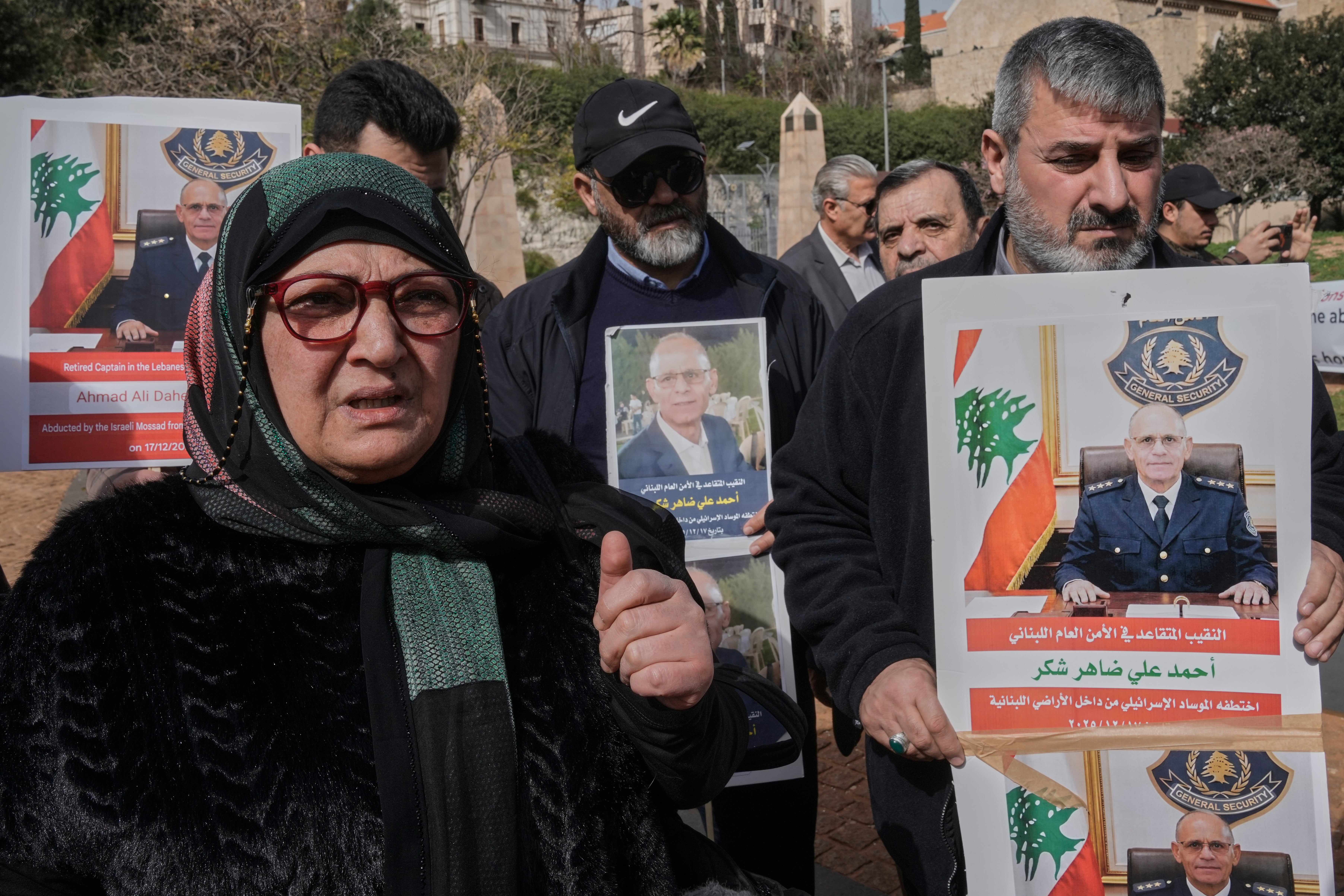Salwa Hazimeh, left, the wife of retired Lebanese officer Ahmed Shukr, speaks during a gathering outside the headquarters of the U.N. Economic and Social Commission for Western Asia, ESCWA, in Beirut, Lebanon (Copyright 2026 The Associated Press. All rights reserved)