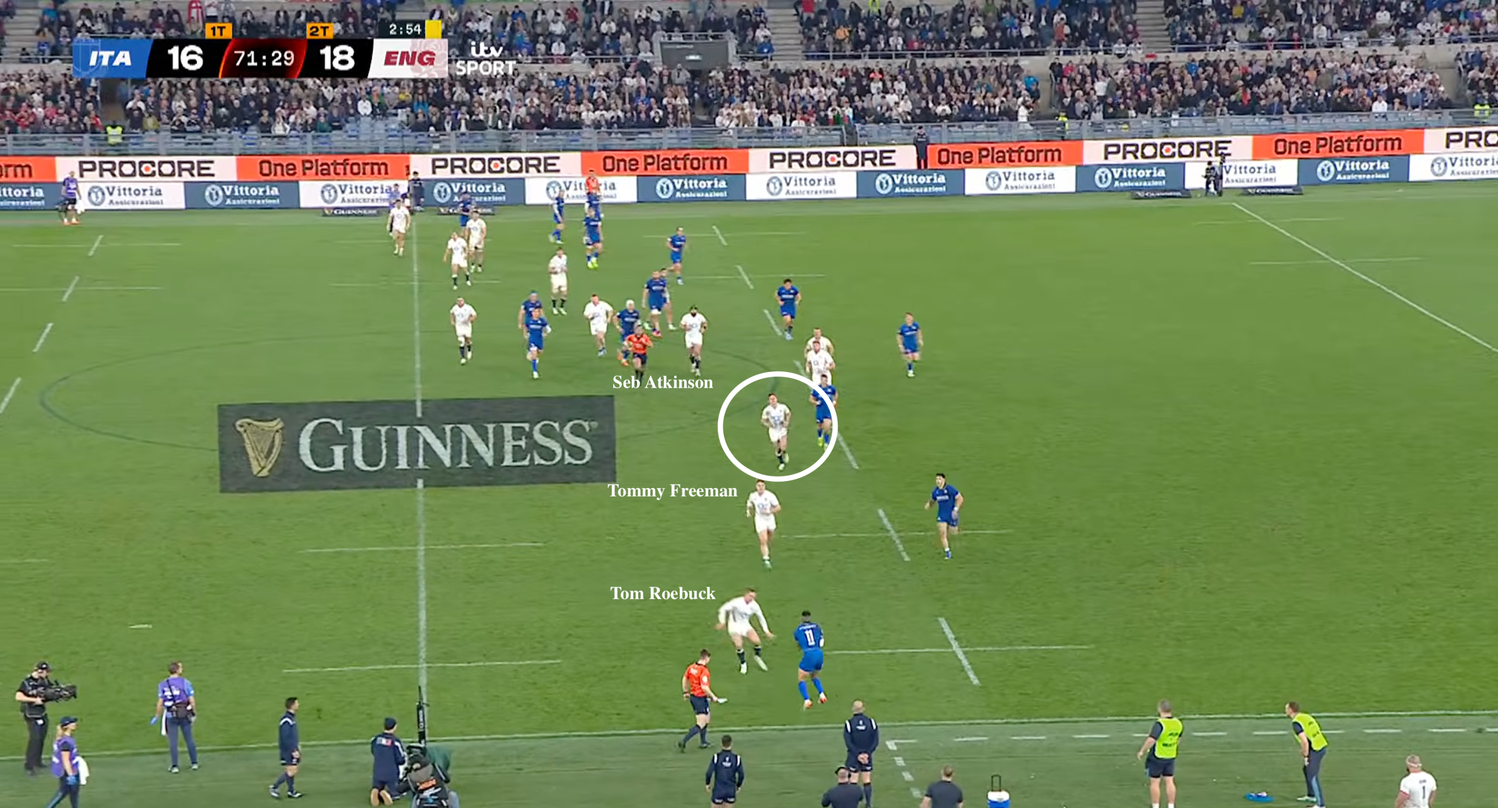 There looks to be little on for Monty Ioane as he takes the kick, with Tom Roebuck in close attention and two more England players on the inside