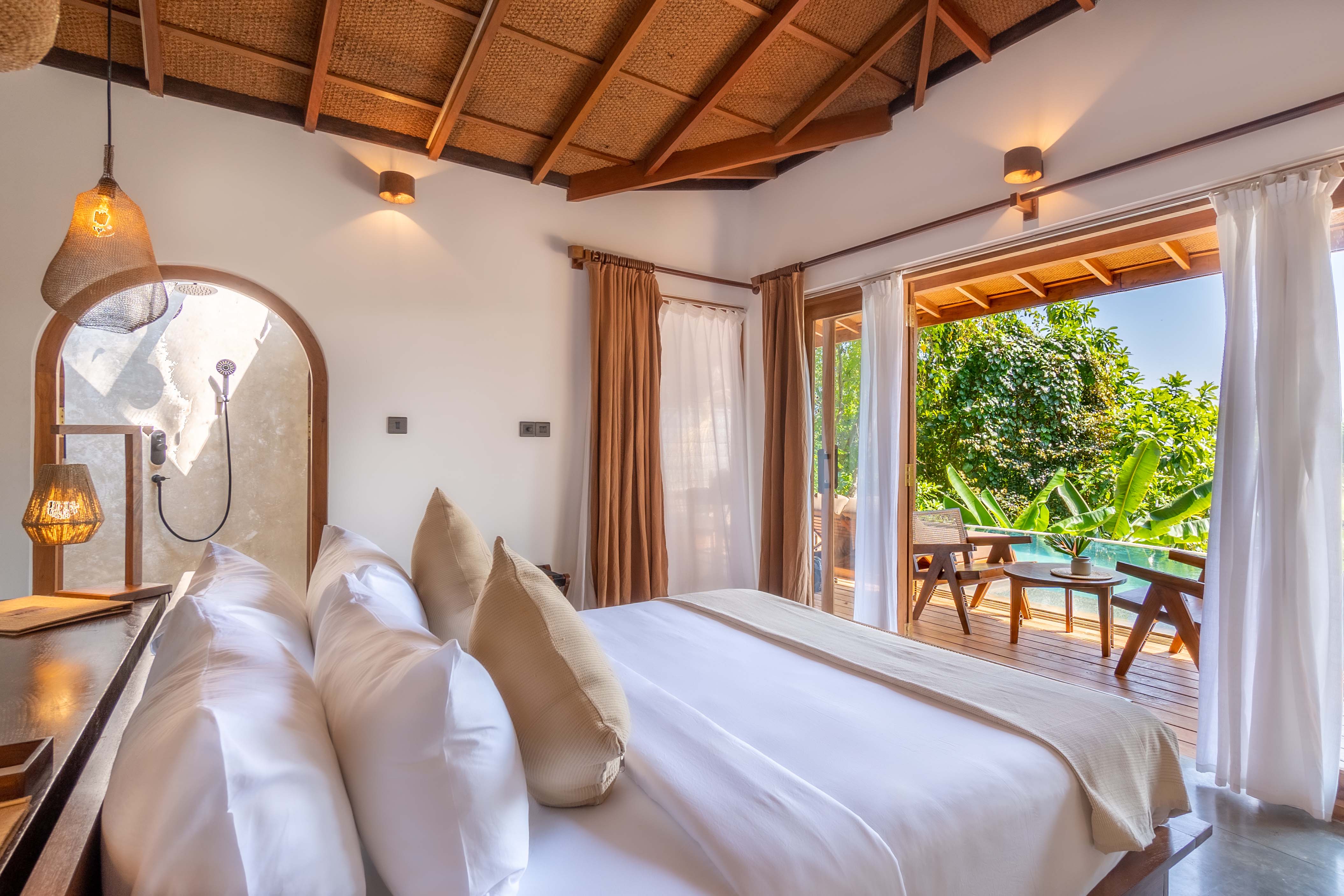 Madiha Hill sits on a lush green hillside