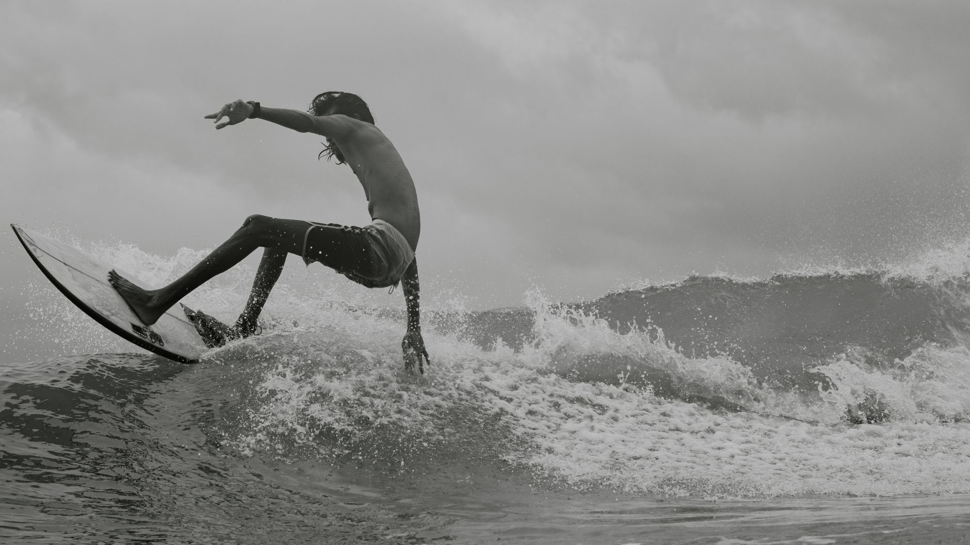 A surfer riding the waves in Madiha