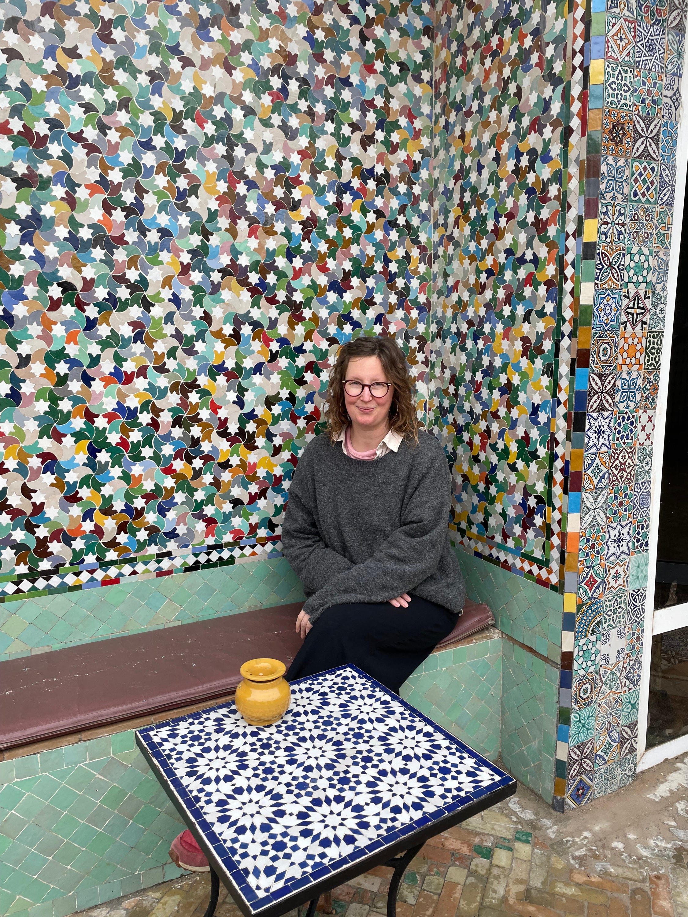 Ella surrounded by traditional mosaic.