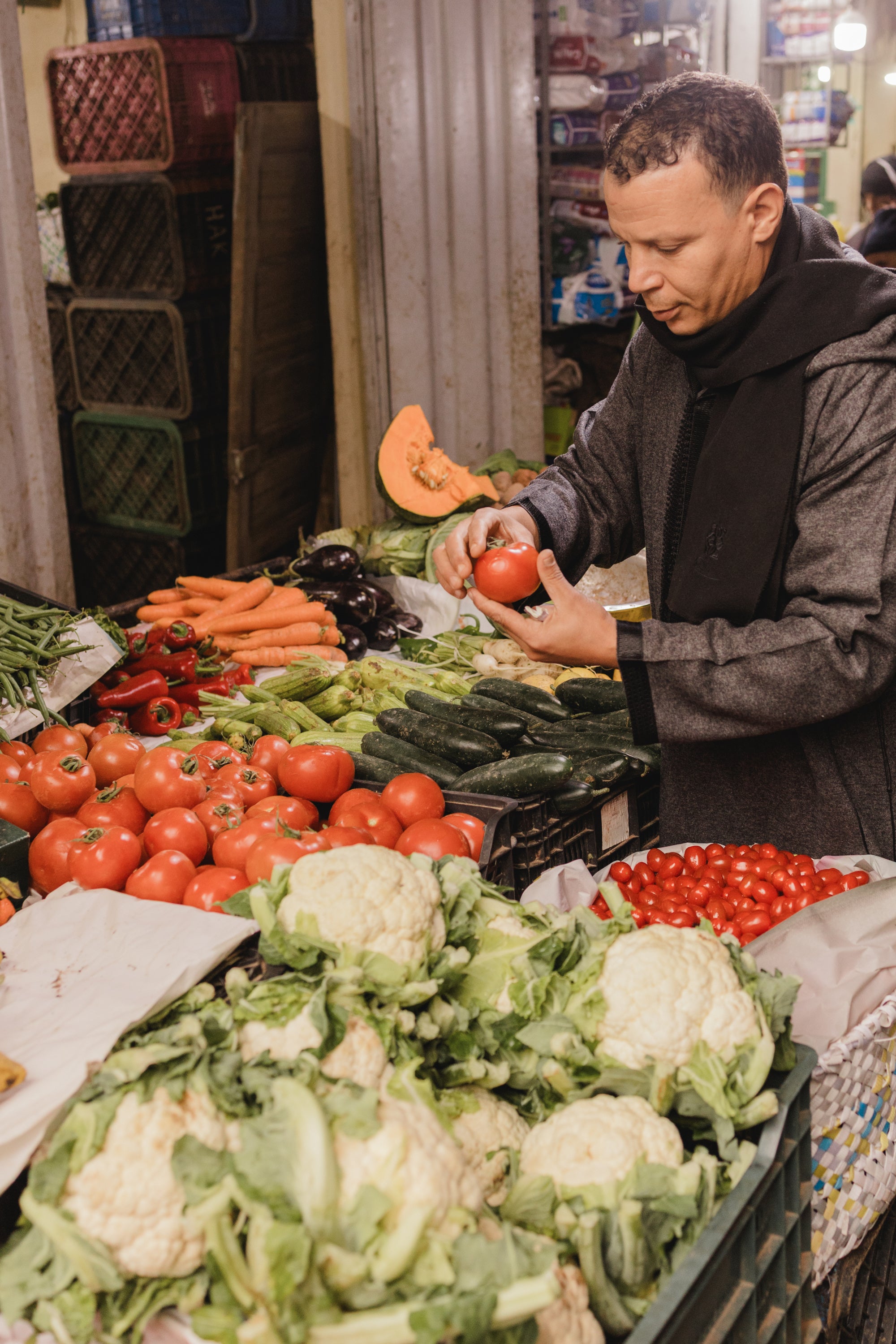 Mohammed shopping in the souk (market) for a shared meal.