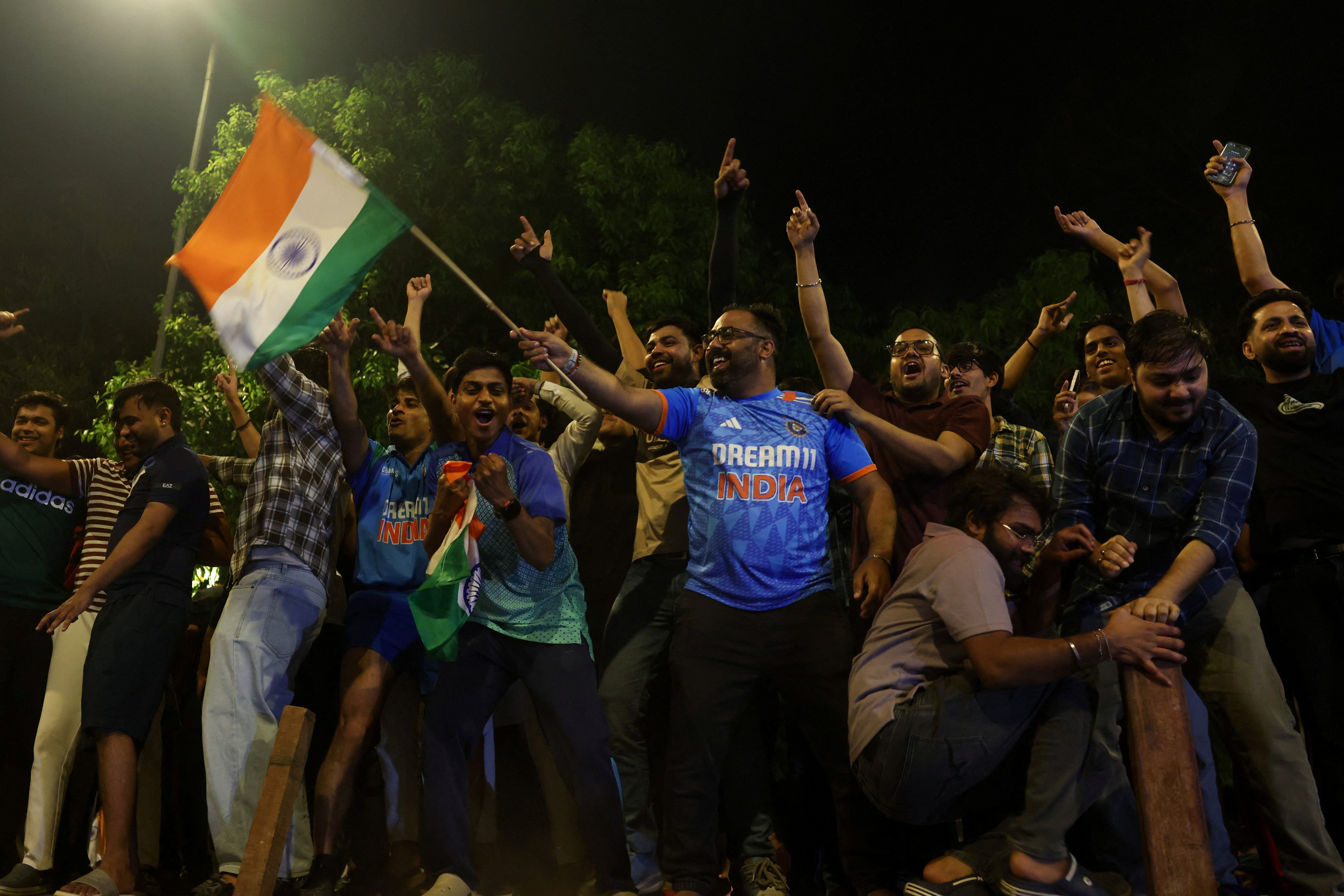 India's cricket fans celebrate after India beats New Zealand in the final cricket match of ICC Men's T20 World Cup 2026, in New Delhi, India