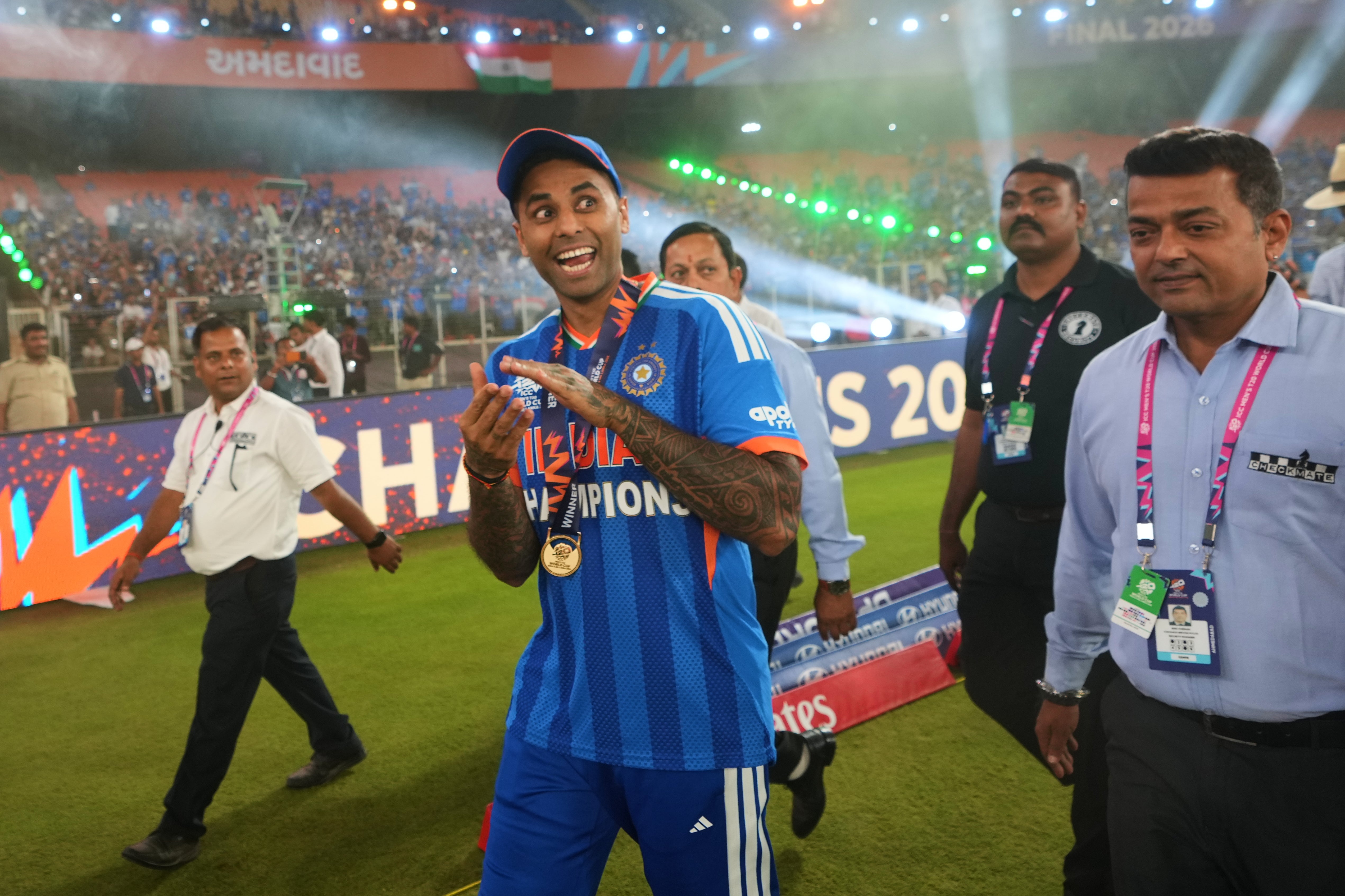 India’s captain Suryakumar Yadav, with his teammates, celebrates after winning the T20 World Cup cricket final match against New Zealand in Ahmedabad, India