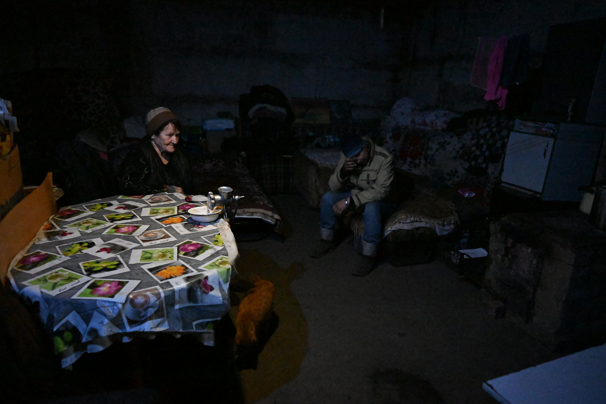 A picture shows local residents housing in a basement shelter in the settlement of Velyka Novosilka (Velikaya Novosyolovka) in the Donetsk region,