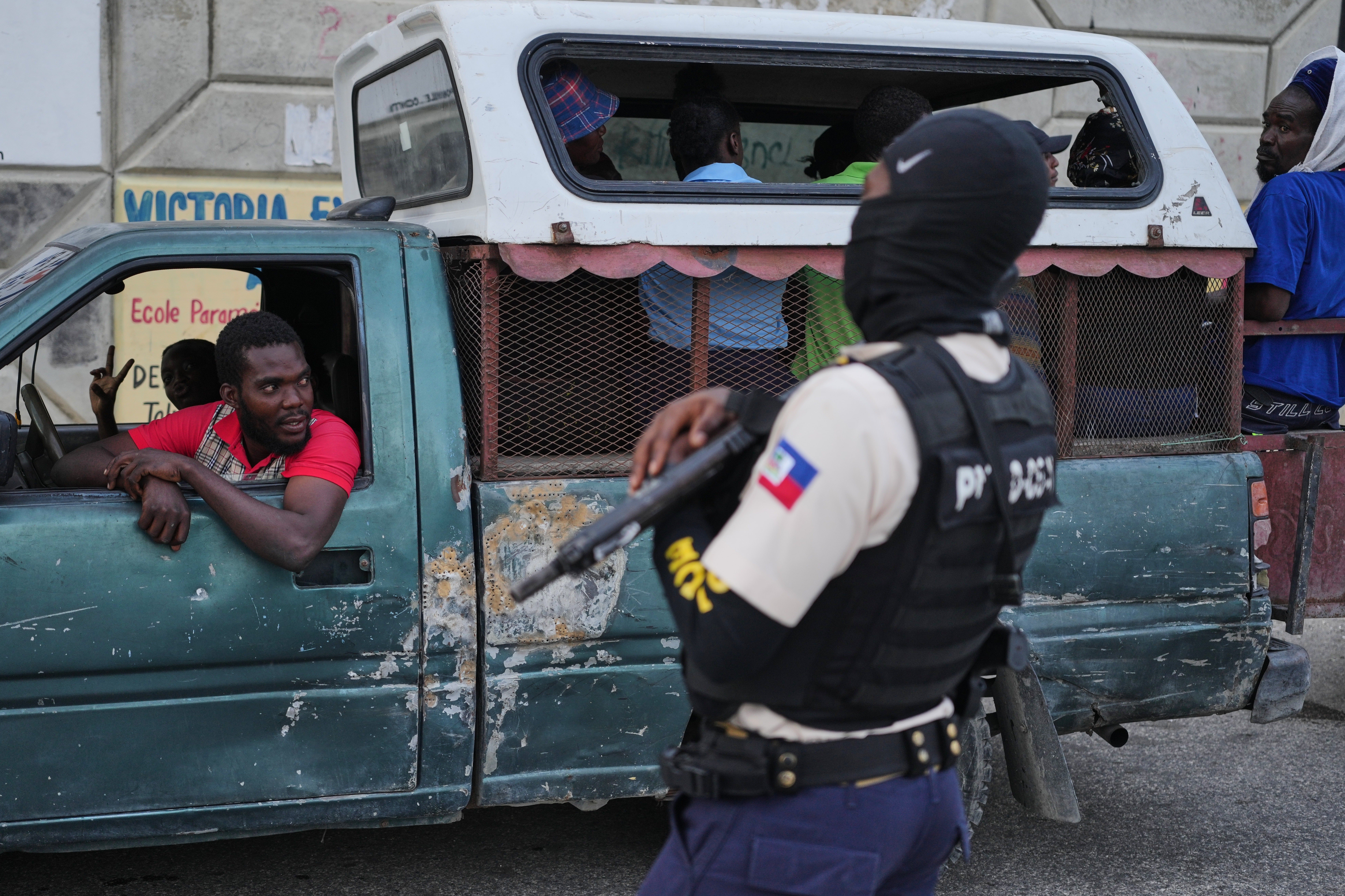 Bodies cover the streets in Haiti as warring gangs torch town and