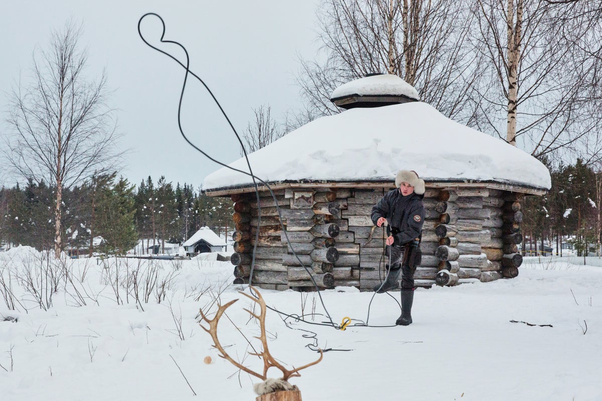Crowds brave sub-zero temperatures to watch reindeer racing near Russian border