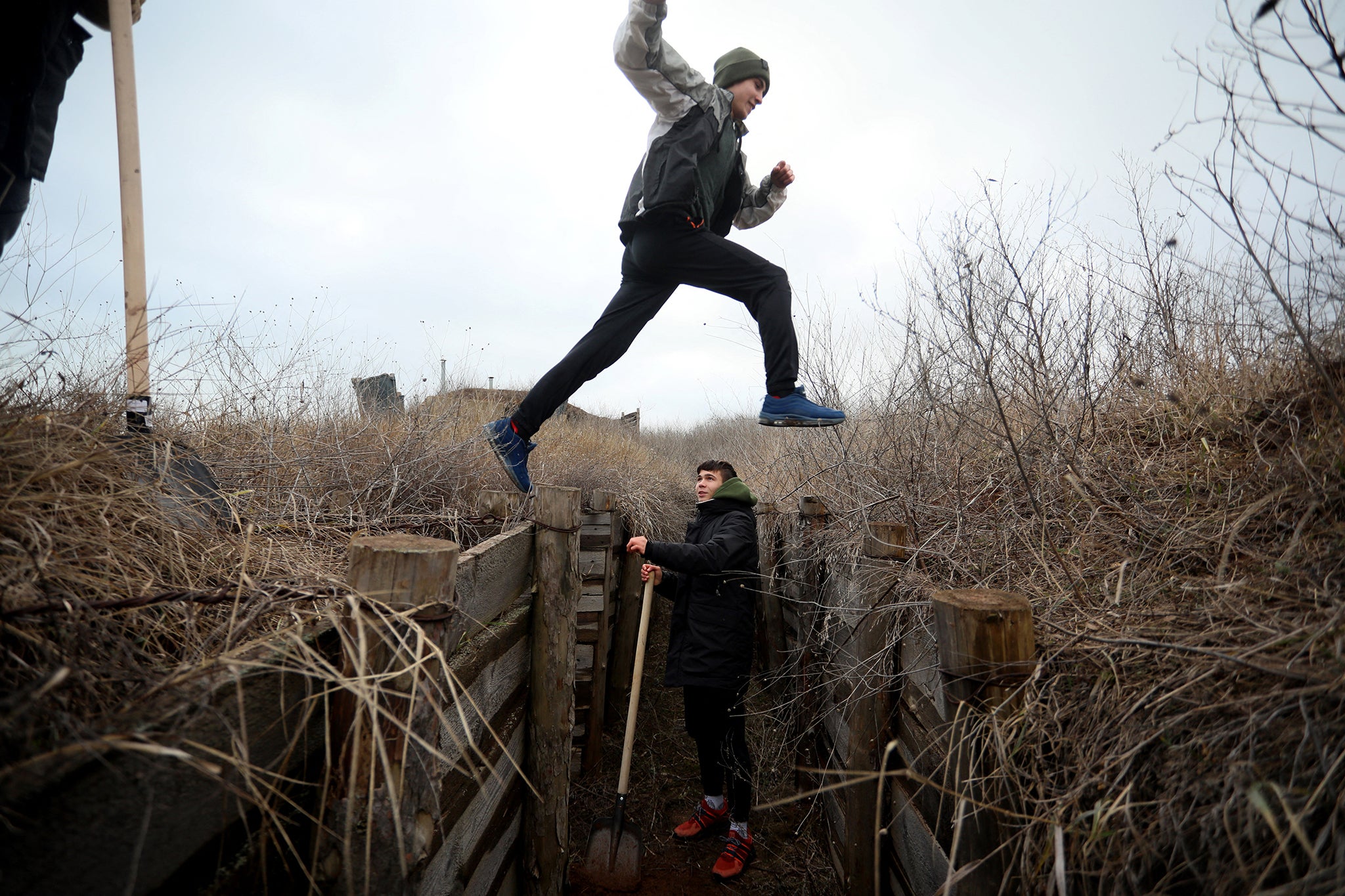 Ukrainian teenagers dig trenches for soldiers facing Russia’s forces on the country’s eastern front